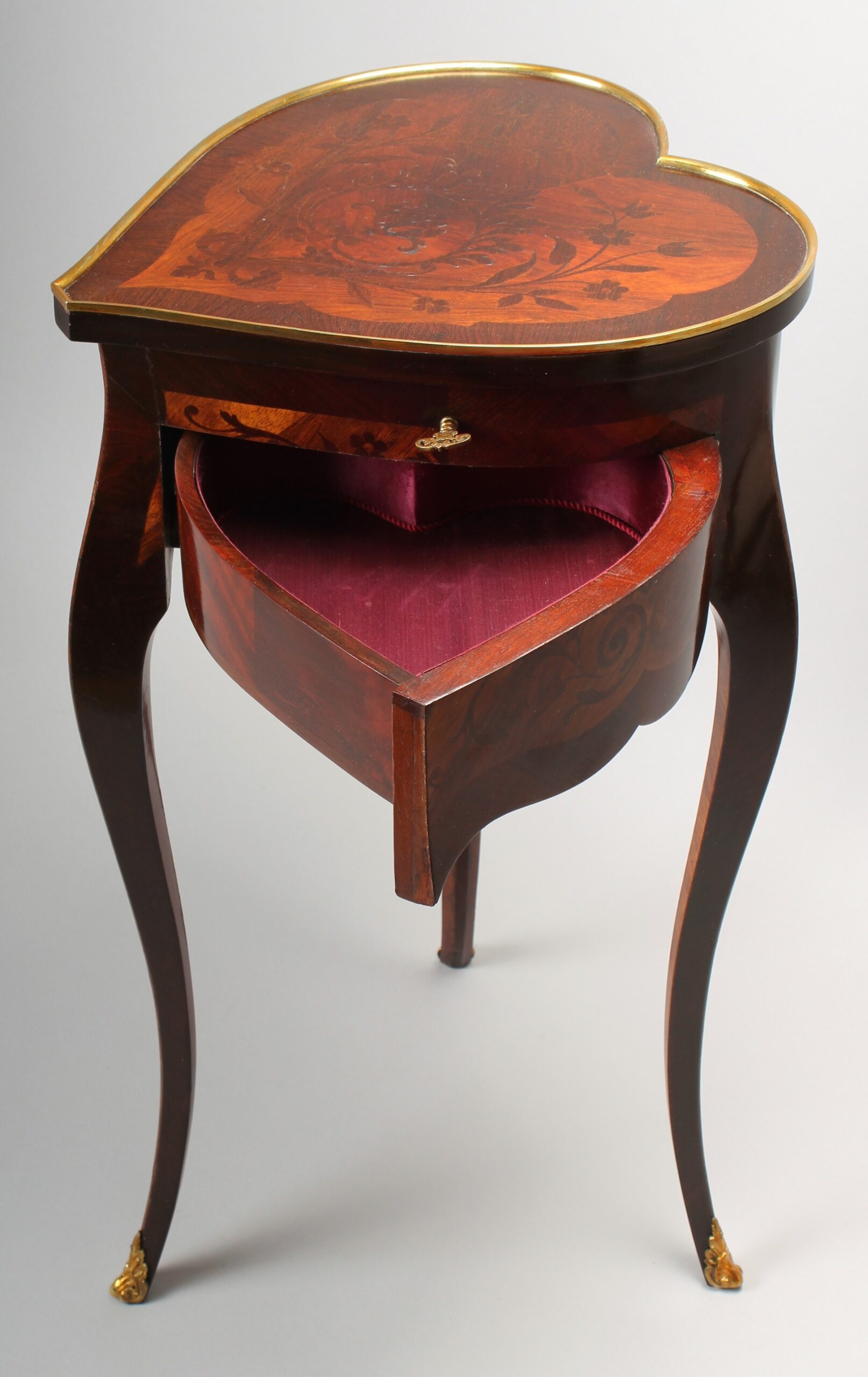 An unusual late 19th century French heart-shaped work-table of Louis XV character