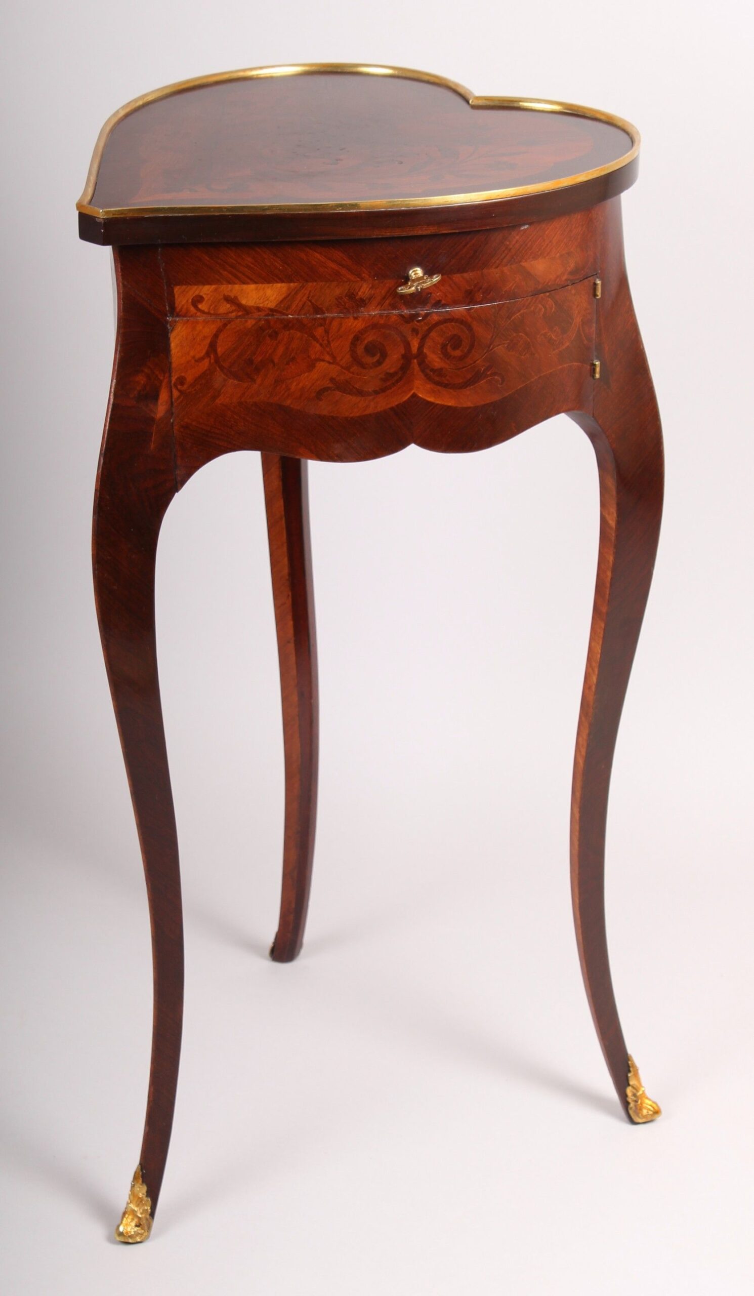 An unusual late 19th century French heart-shaped work-table of Louis XV character
