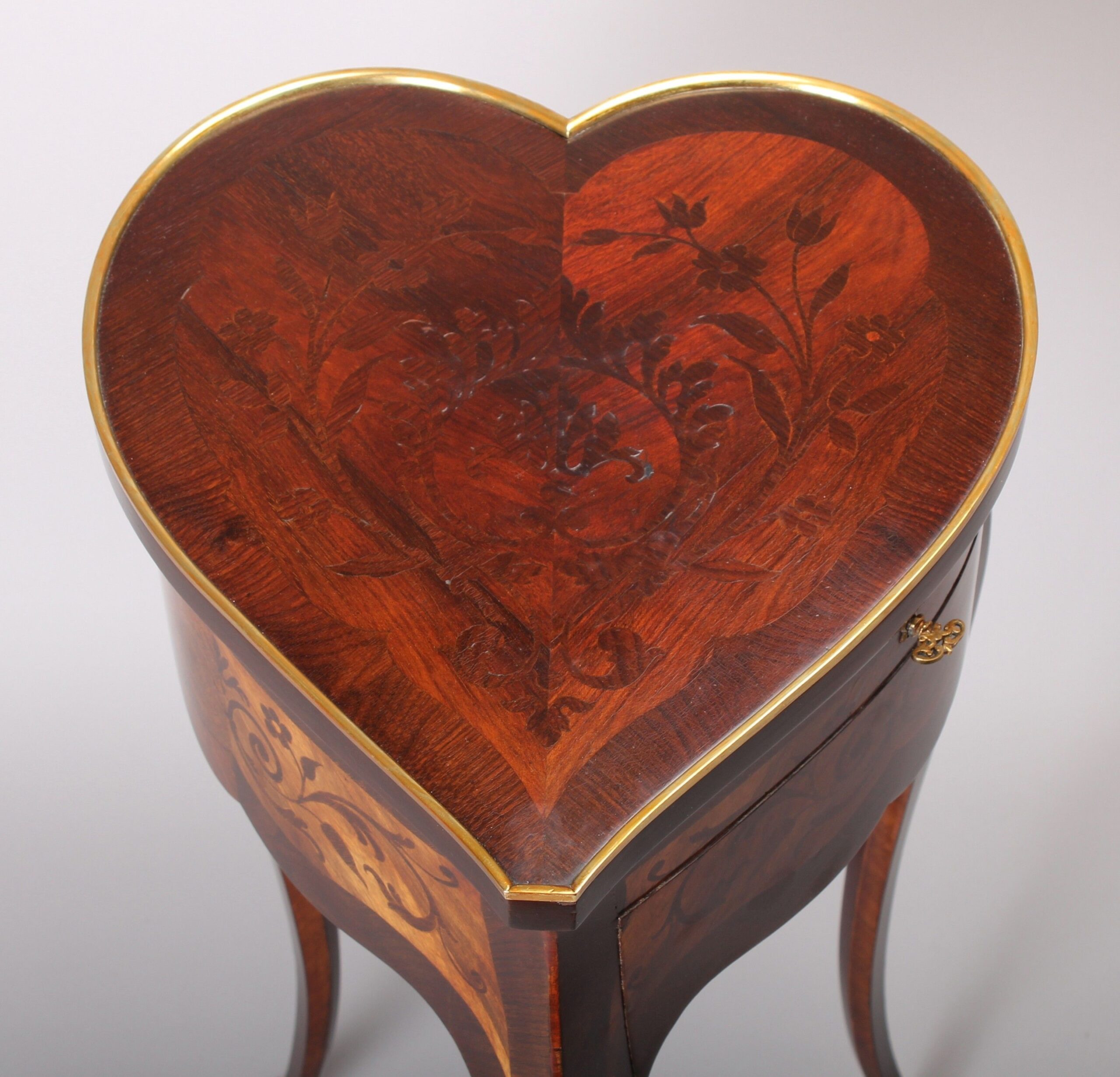 An unusual late 19th century French heart-shaped work-table of Louis XV character