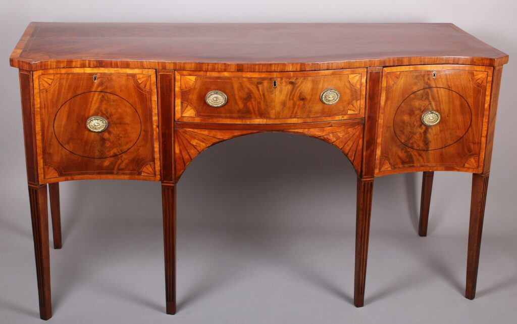 George III period mahogany and satinwood banded serpentine-fronted sideboard