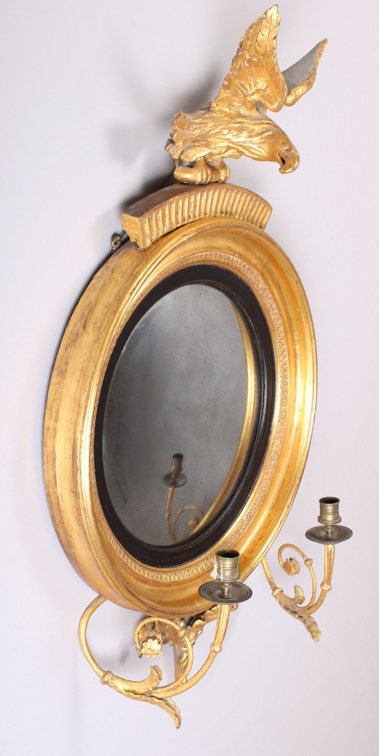 Regency gilt wood convex girandole mirror of small proportions