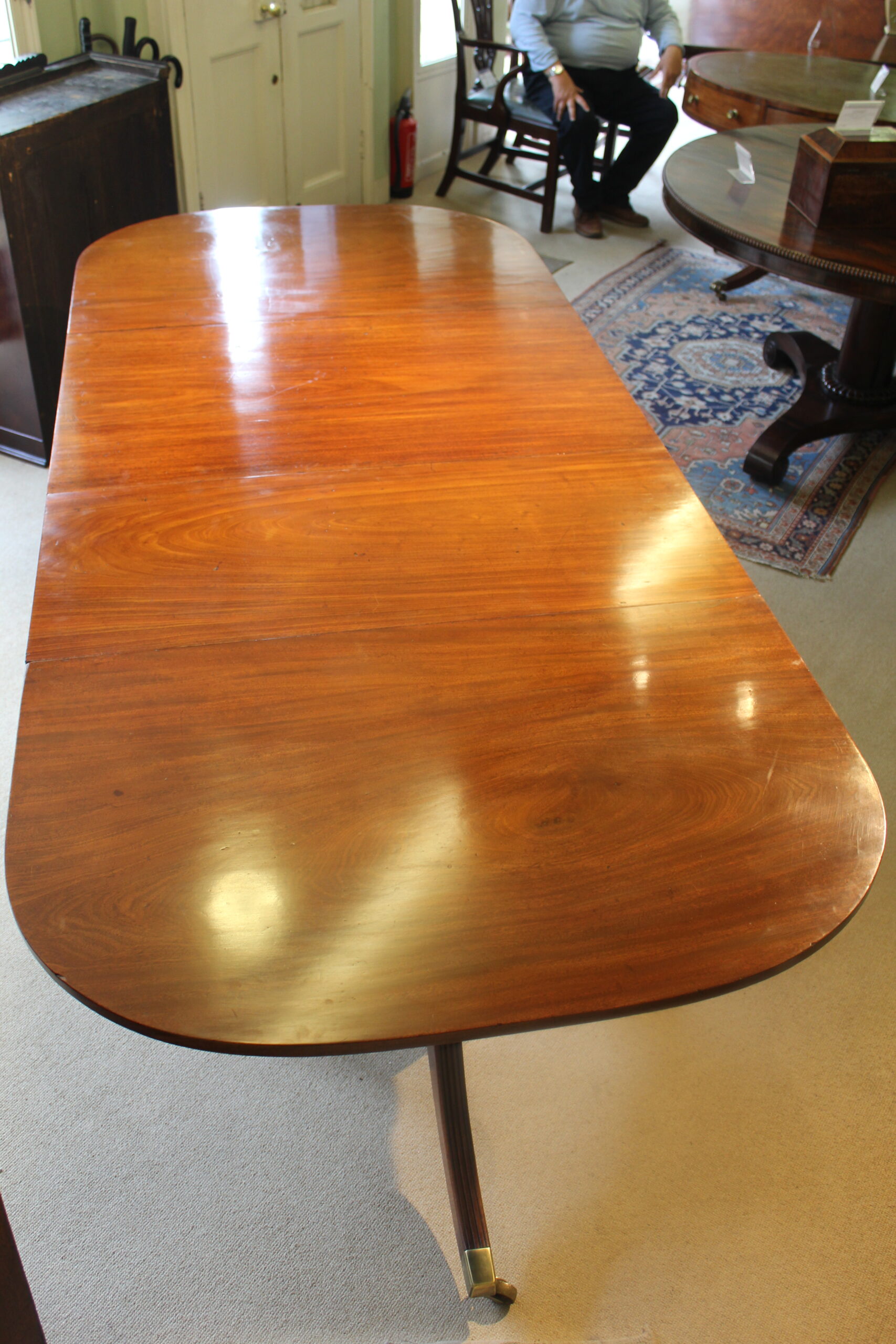 Early 19th century mahogany two-pillar dining table