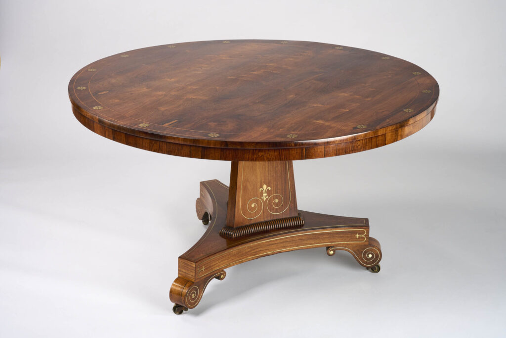 A fine George III period rosewood brass inlaid centre table