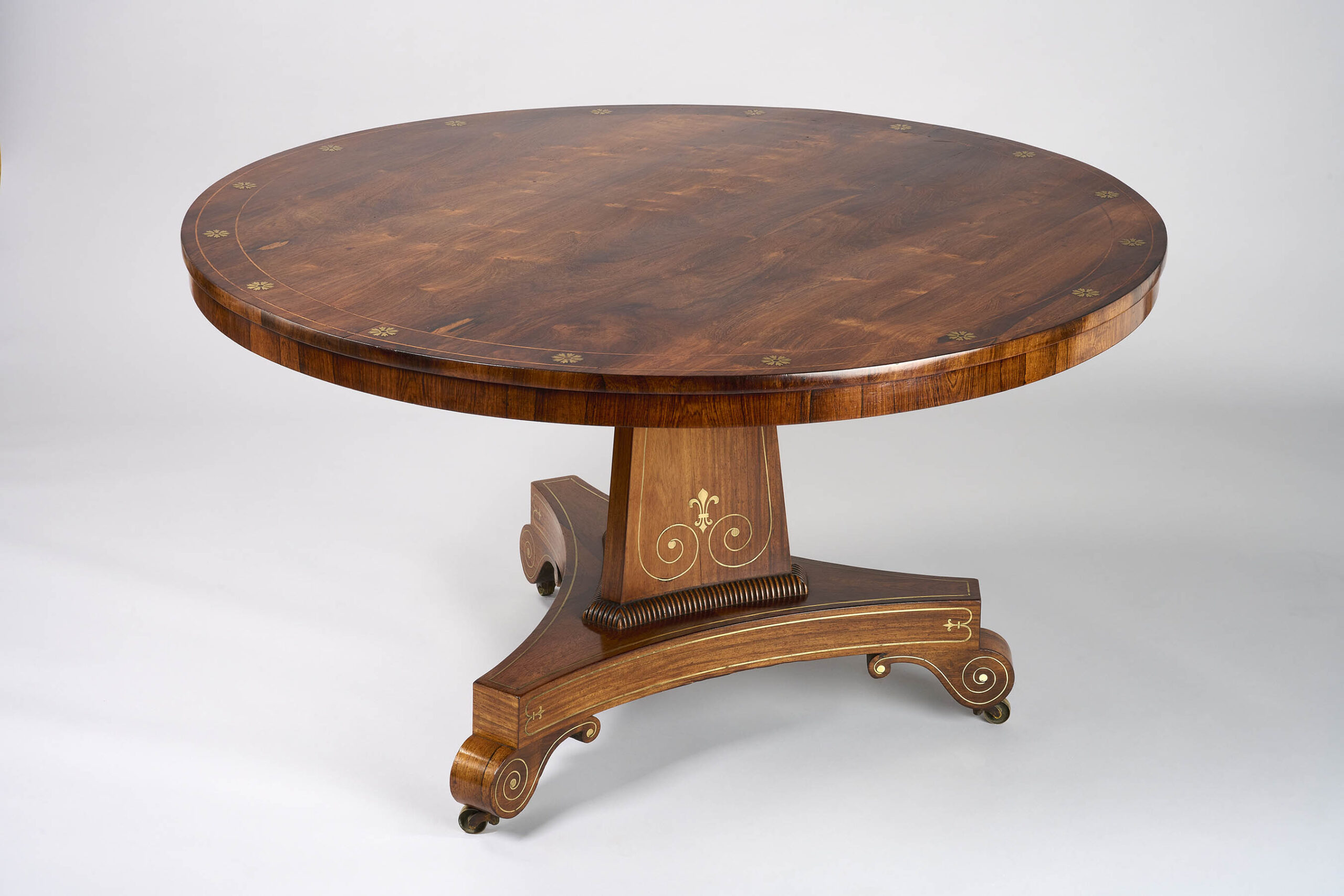 A fine George III period rosewood brass inlaid centre table