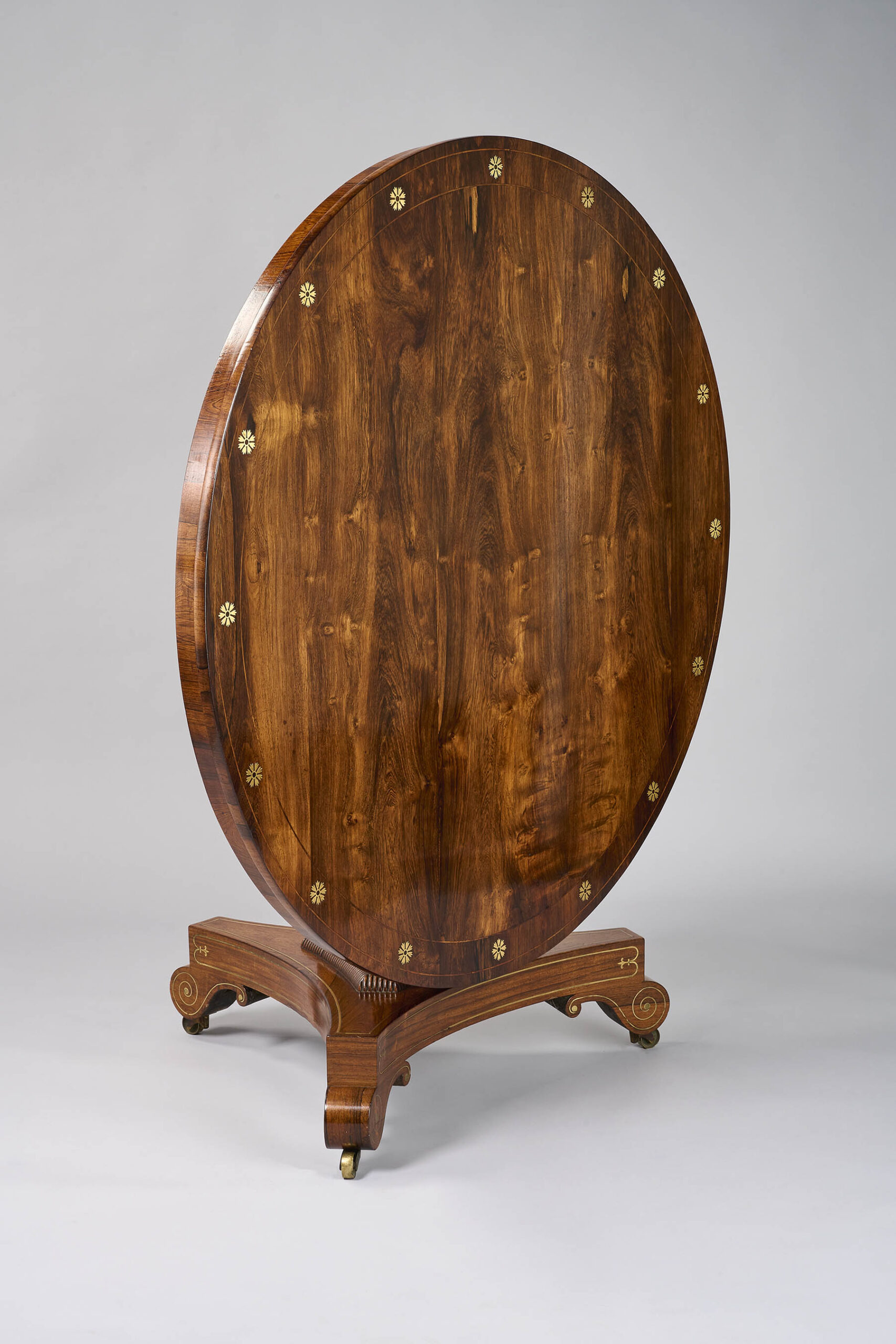 A fine George III period rosewood brass inlaid centre table
