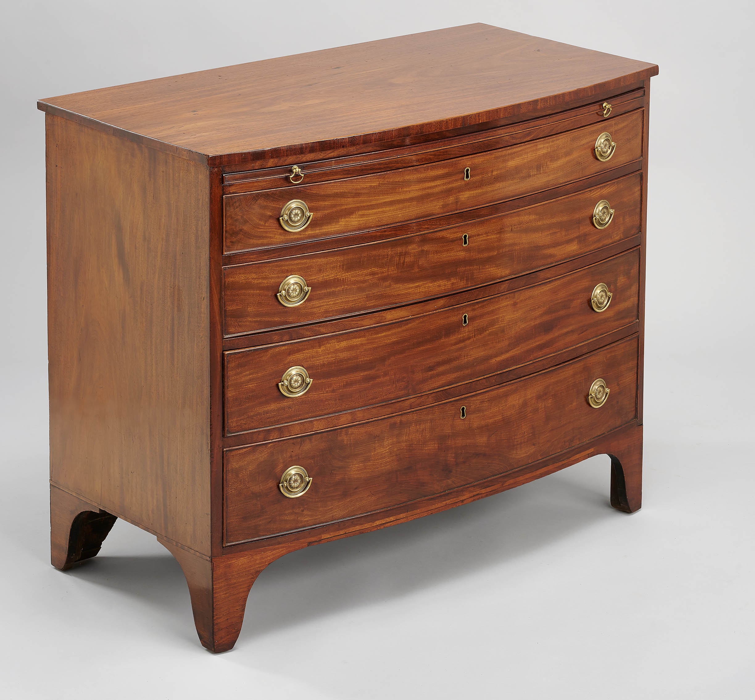 Rare pair of George III period mahogany bow-fronted chests-of-drawers