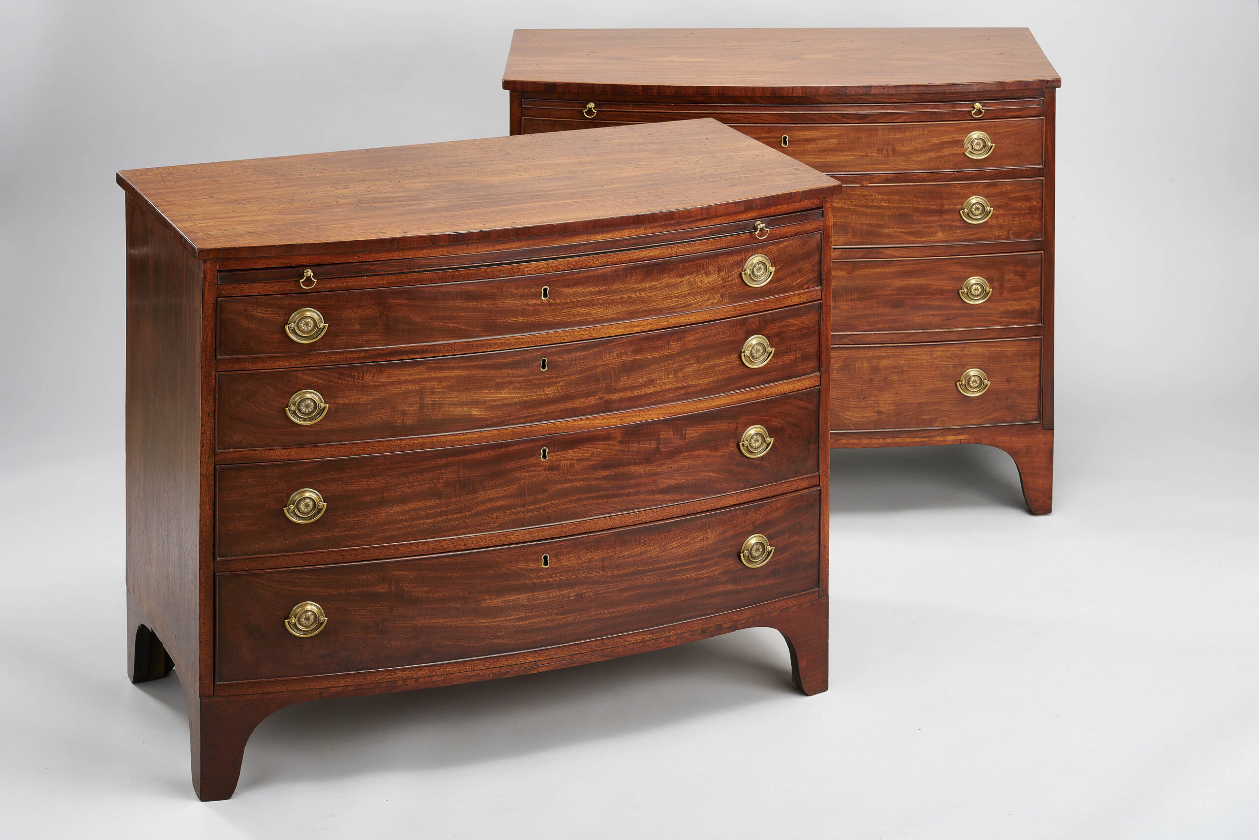 Rare pair of George III period mahogany bow-fronted chests-of-drawers