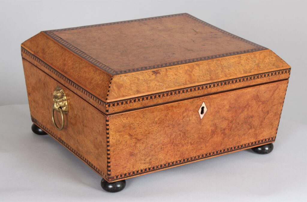 A Regency period birdseye maple lidded work box