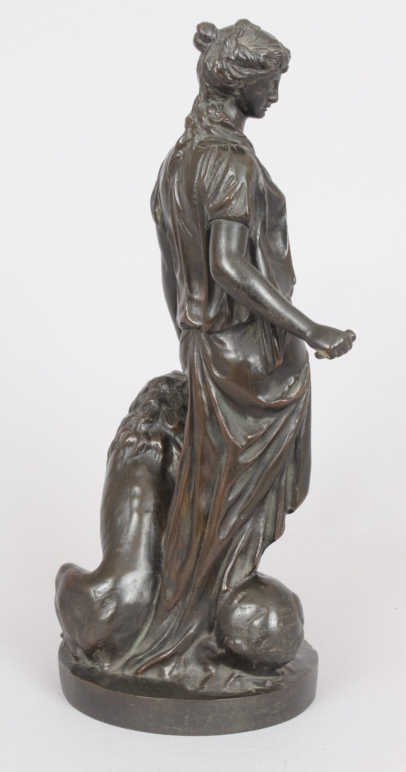 Bronze statuette of a classical woman and lion