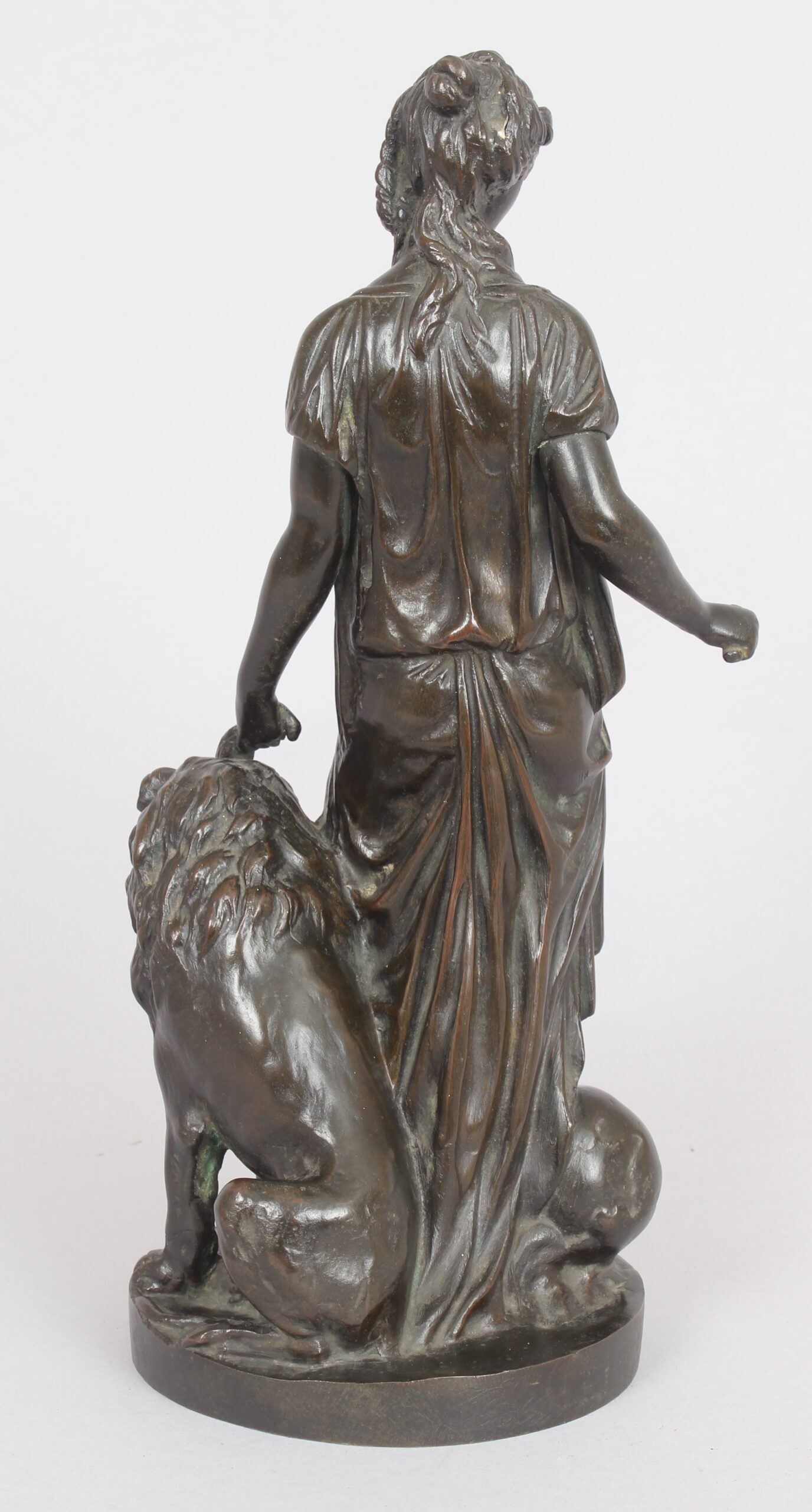 Bronze statuette of a classical woman and lion