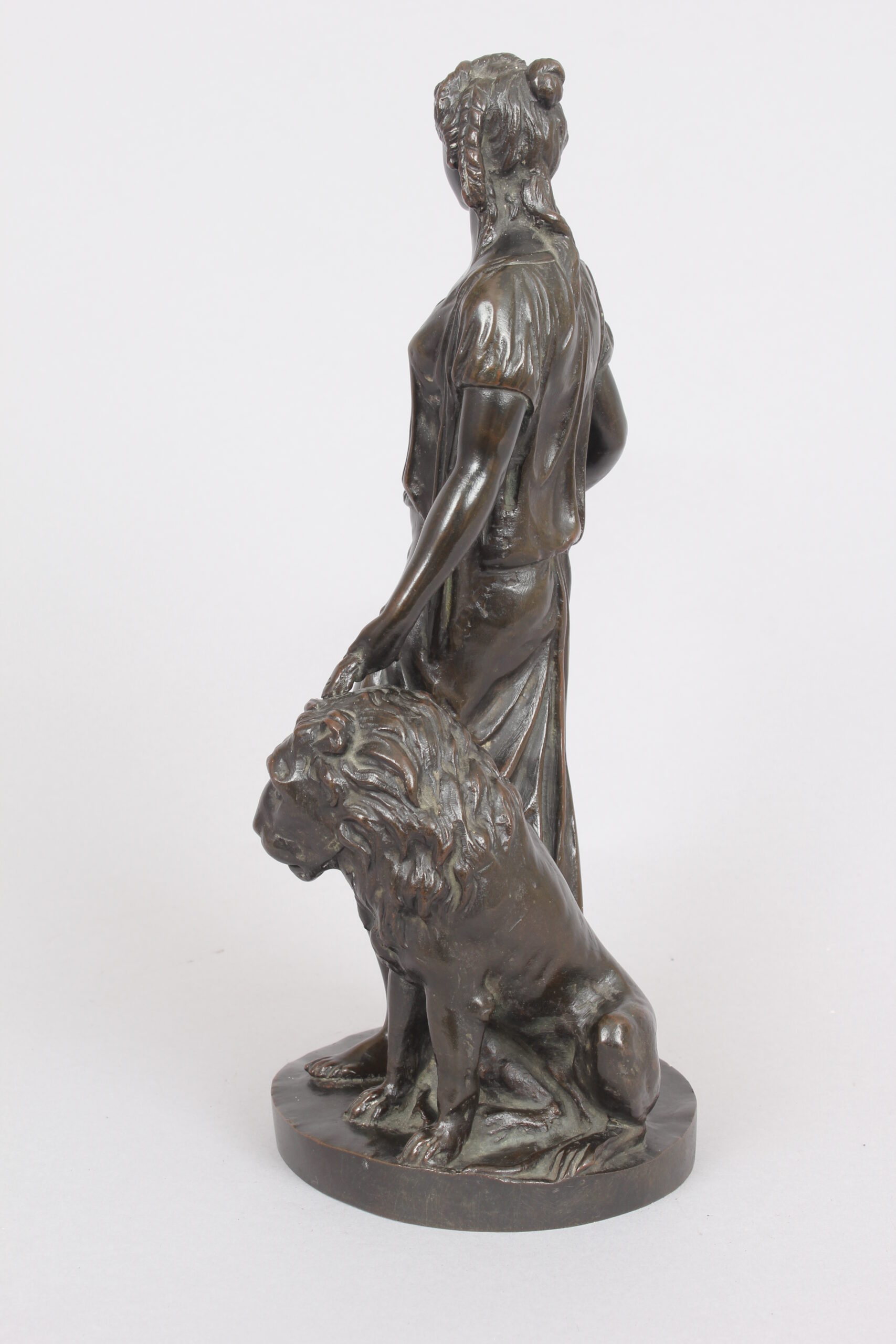 Bronze statuette of a classical woman and lion