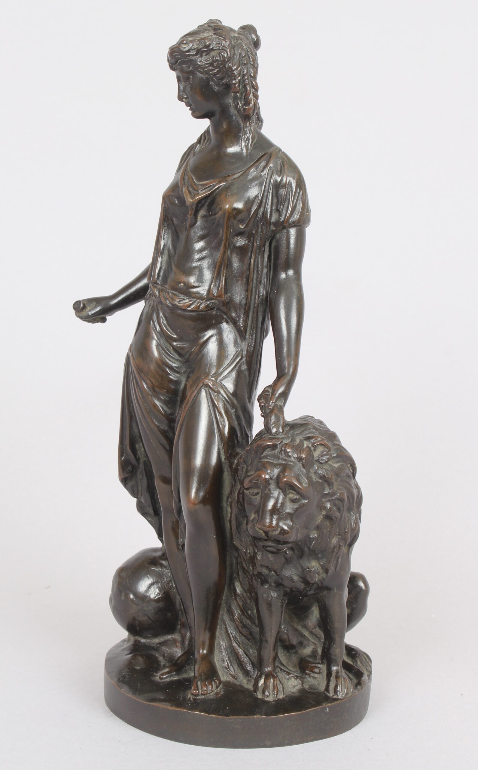 Bronze statuette of a classical woman and lion