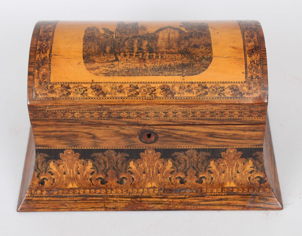 A rosewood domed top tea caddy