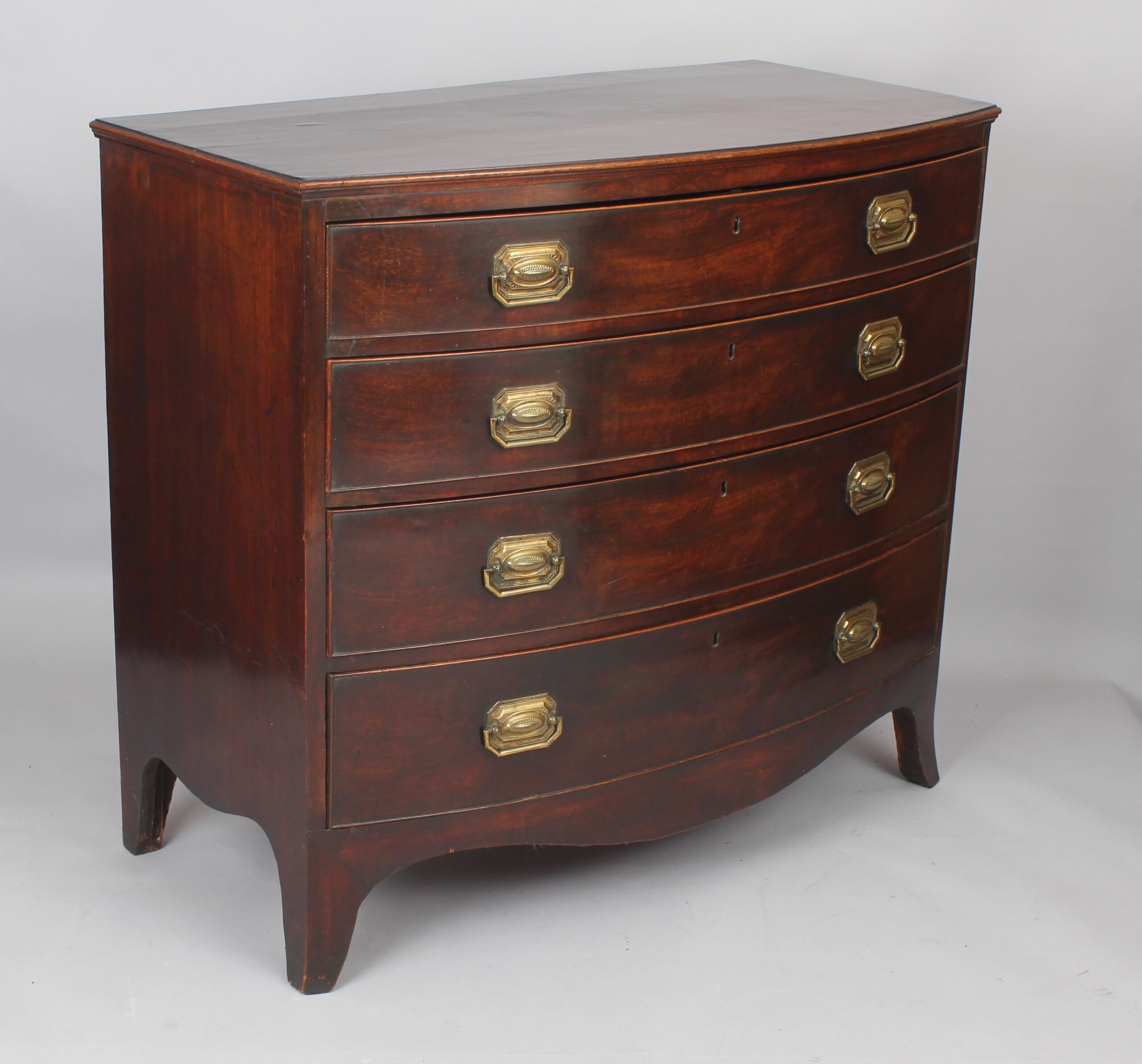 George III mahogany bow-fronted chest of four graduated drawers