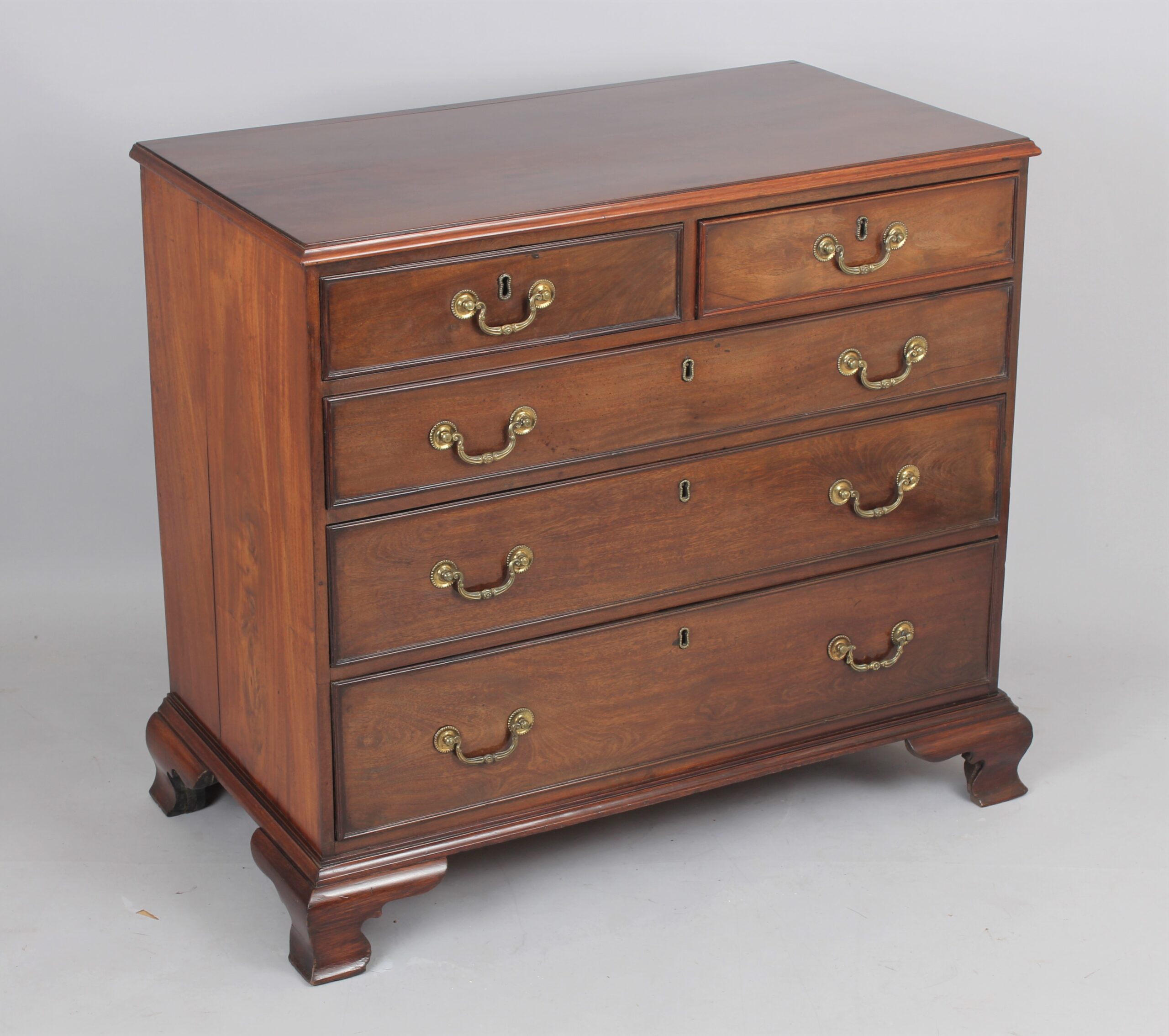 George III mahogany chest of two short and three long graduated and cock-beaded drawers