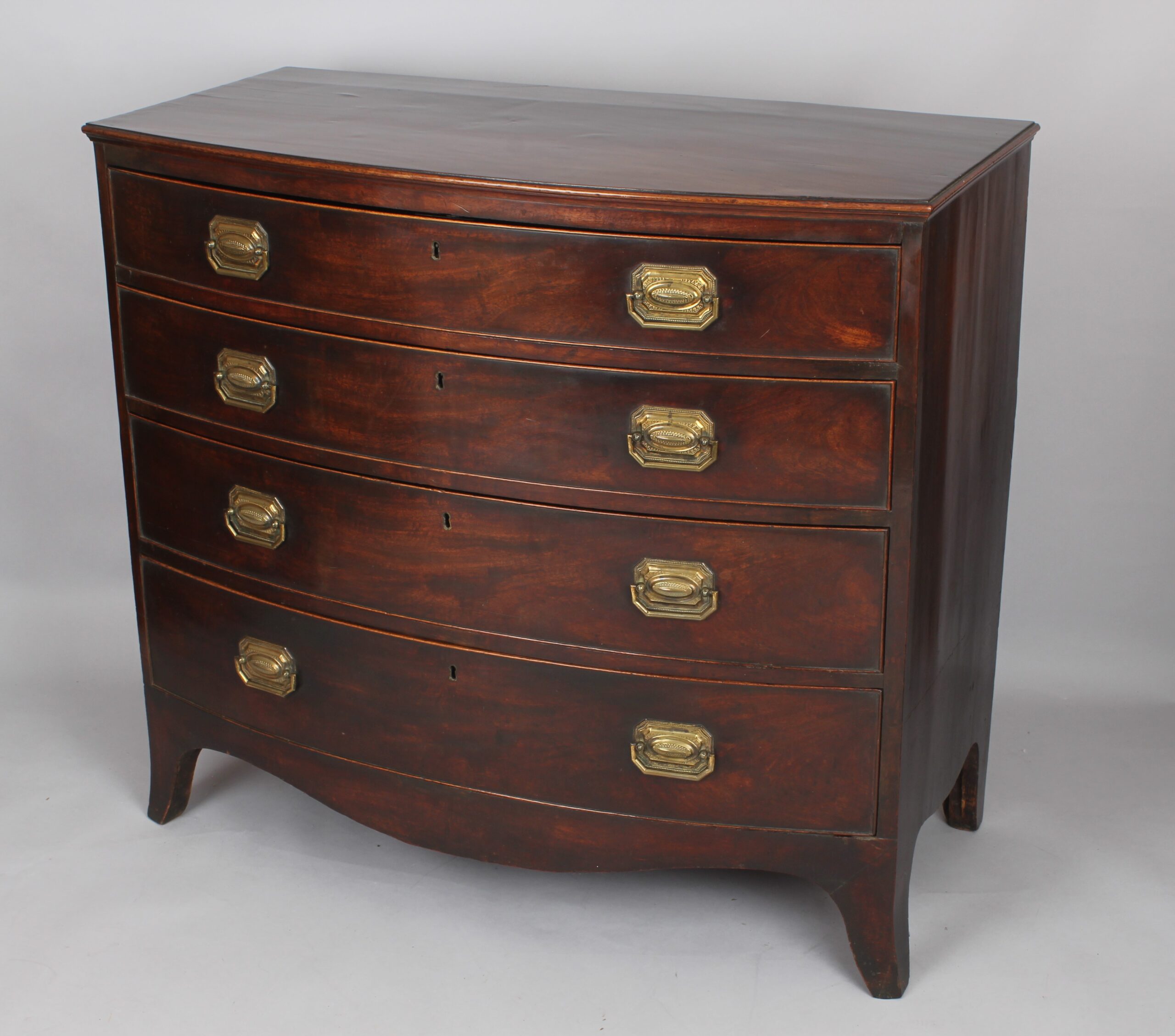 George III mahogany bow-fronted chest of four graduated drawers