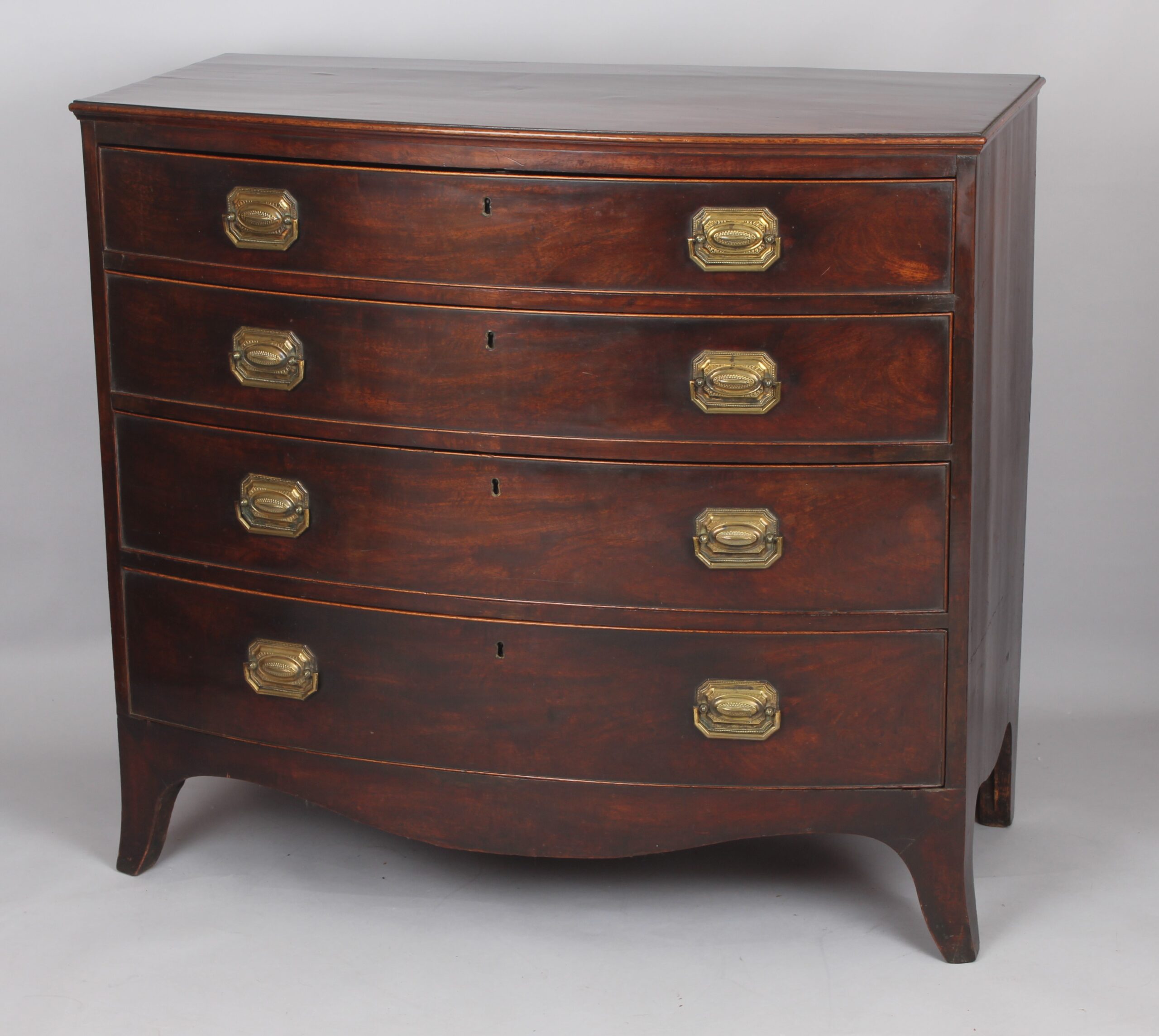 George III mahogany bow-fronted chest of four graduated drawers