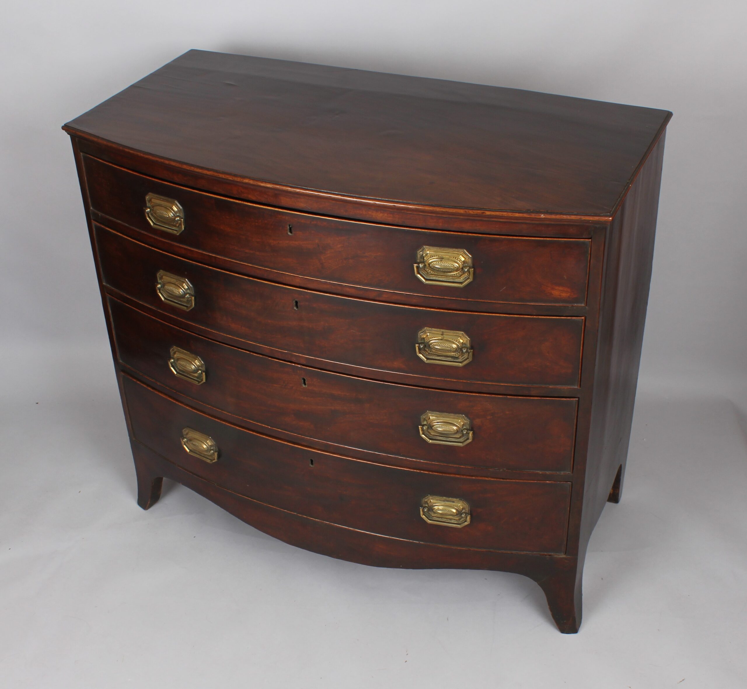 George III mahogany bow-fronted chest of four graduated drawers
