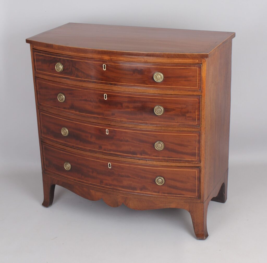 Mahogany bow-fronted chest of four graduated drawers