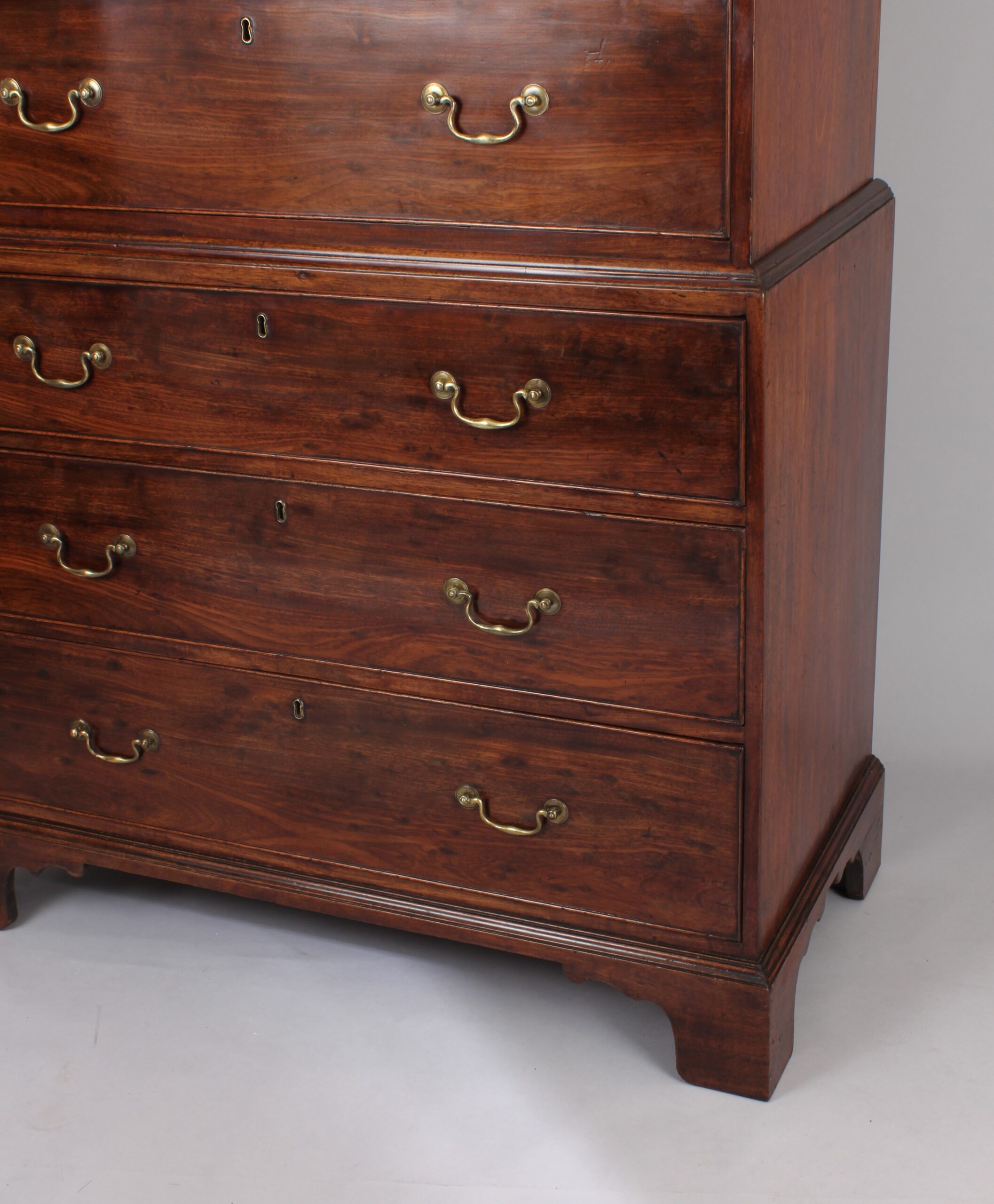 Fine quality figured plum pudding mahogany chest on chest tallboy of especially small size