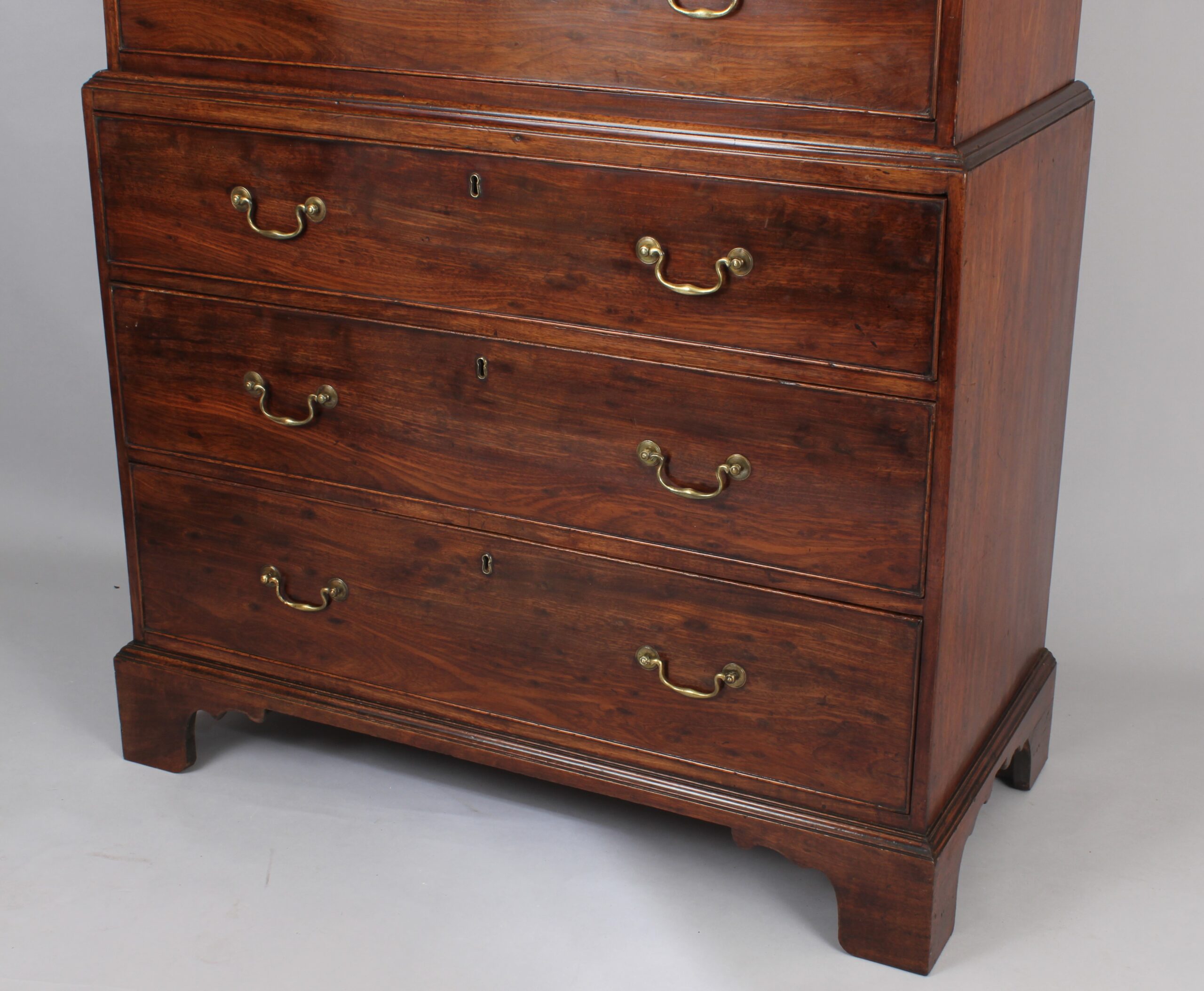 Fine quality figured plum pudding mahogany chest on chest tallboy of especially small size