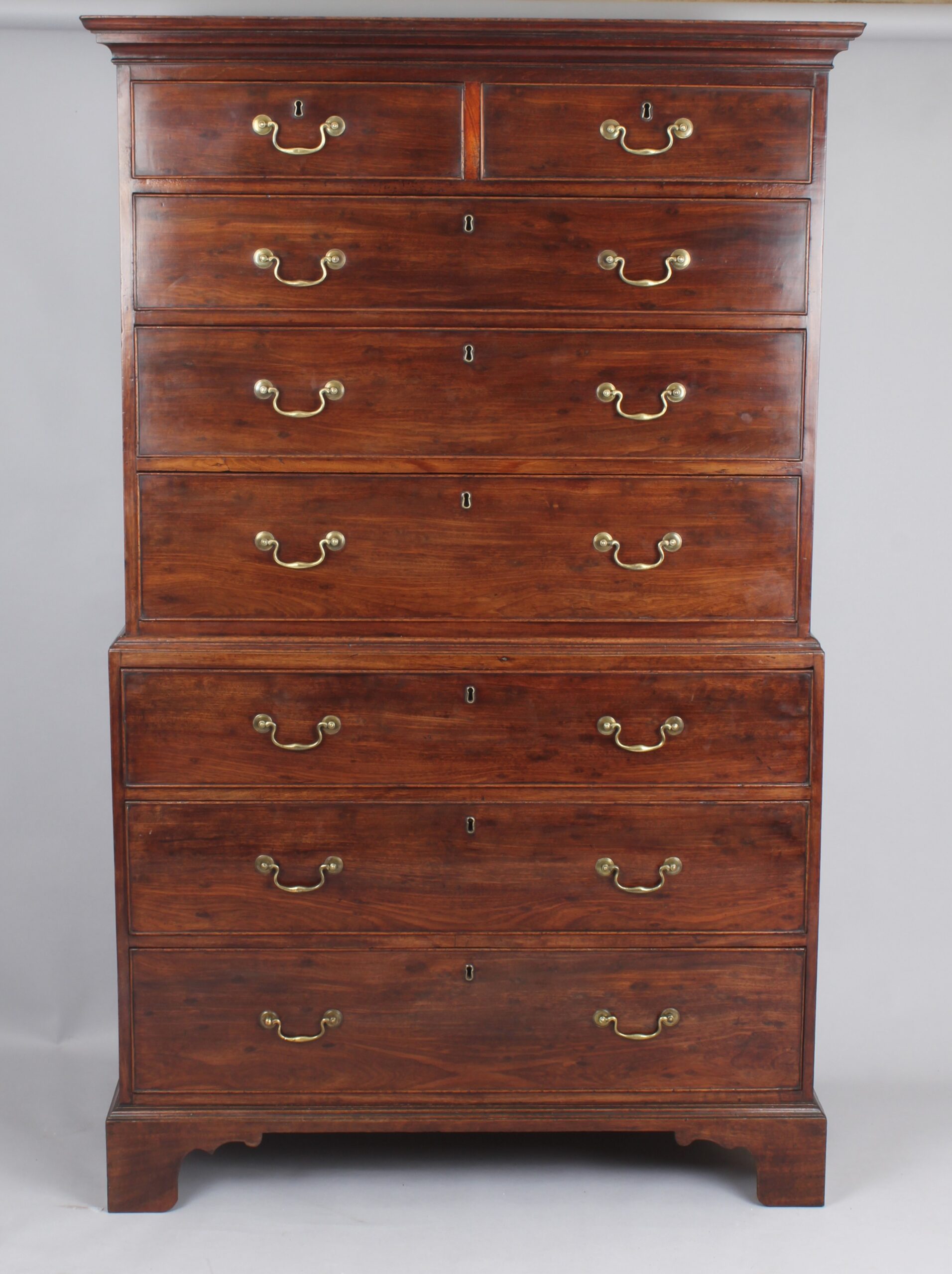 Fine quality figured plum pudding mahogany chest on chest tallboy of especially small size