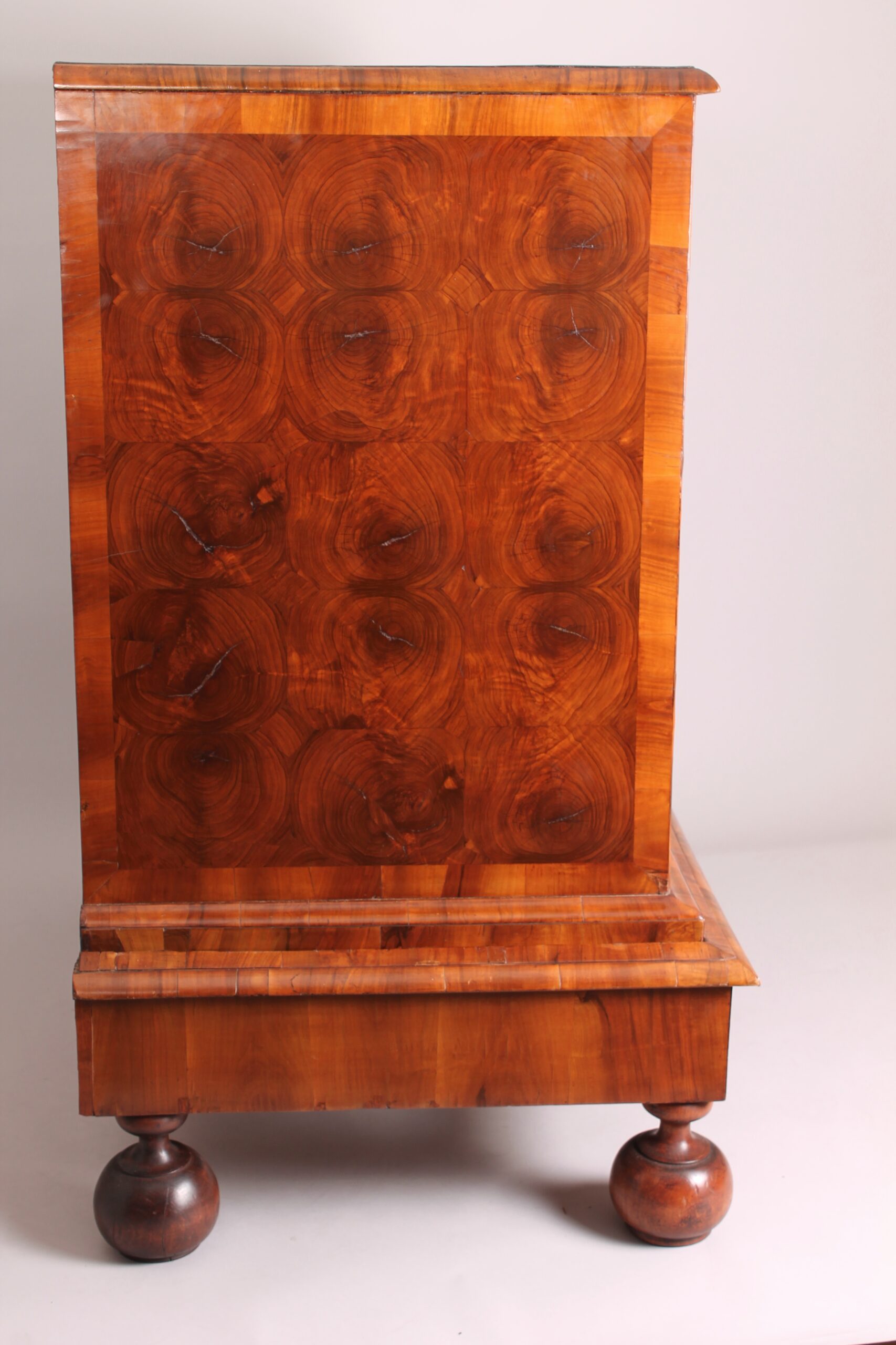 A fine and rare walnut oyster-piece chest-on-stand