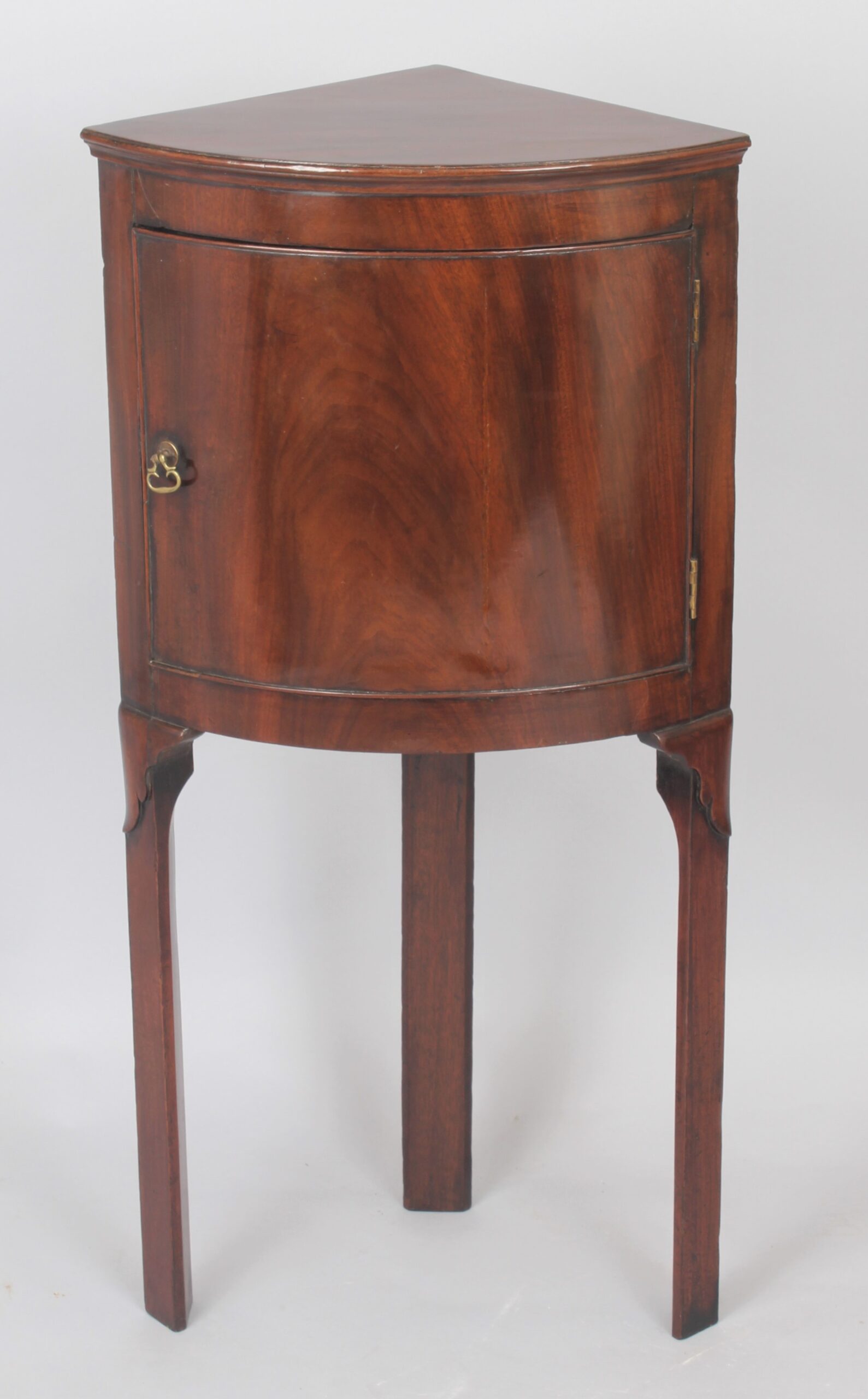 George III period mahogany bow-fronted corner cupboard