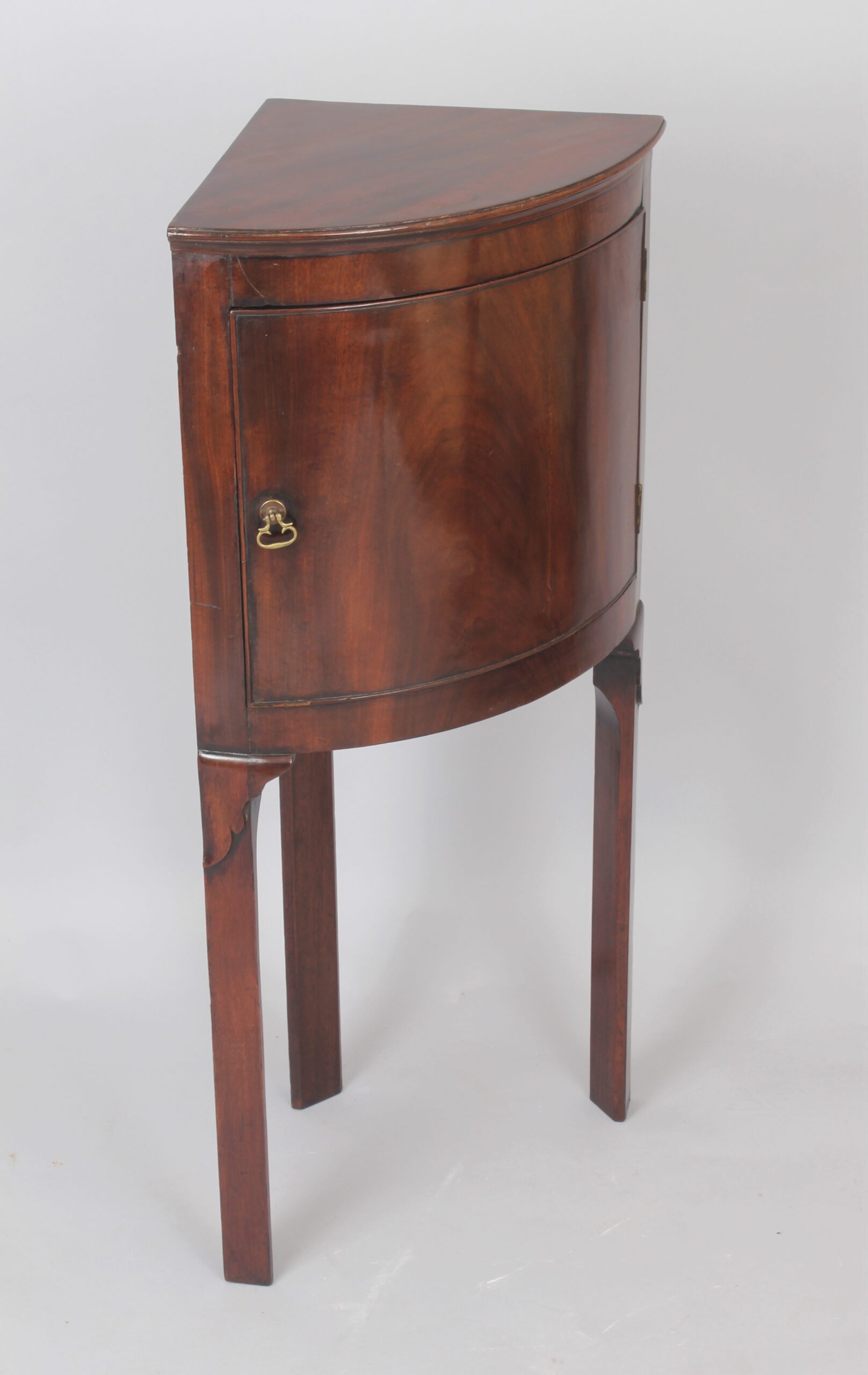 George III period mahogany bow-fronted corner cupboard