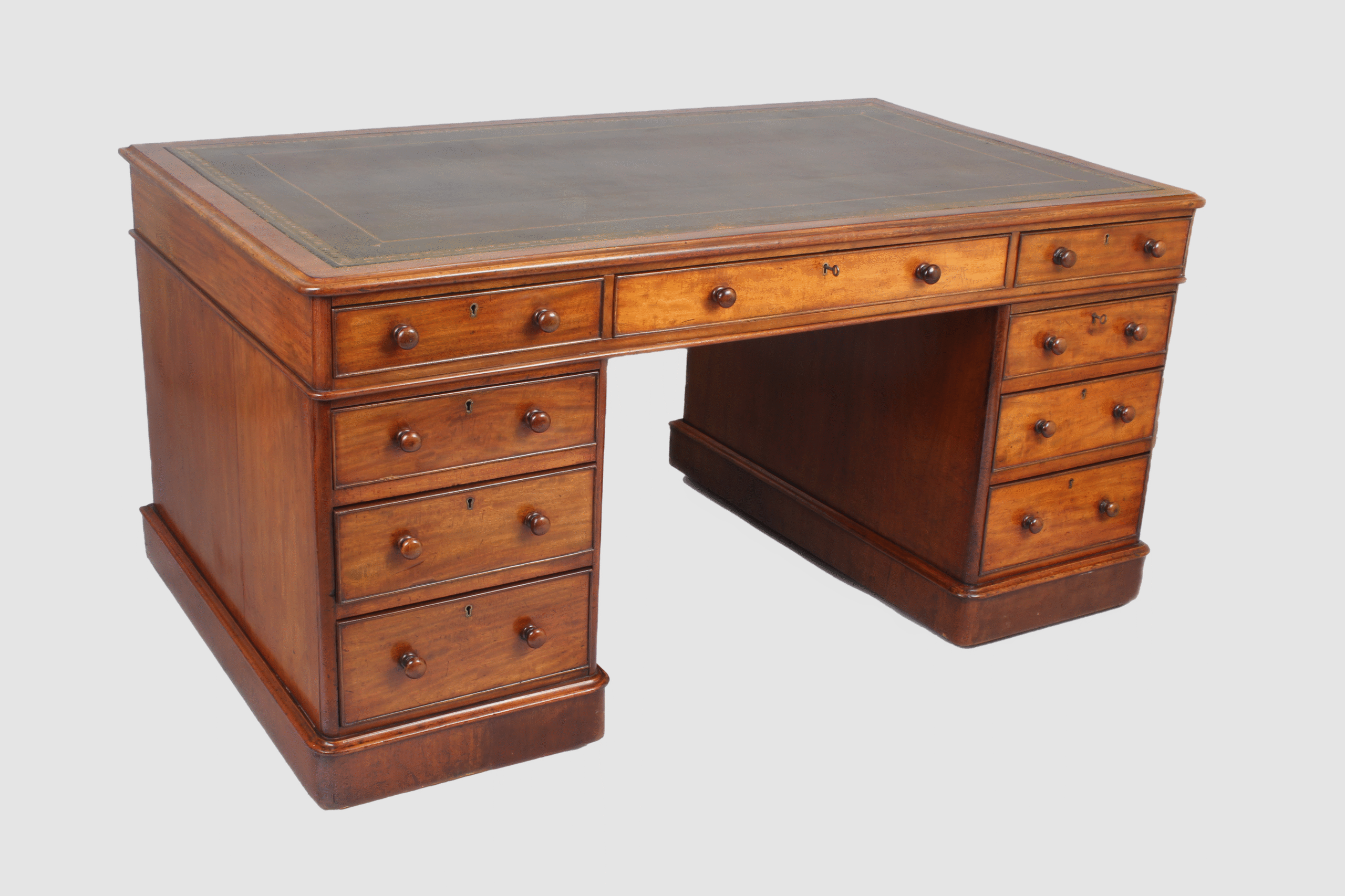 A William IV mahogany three part free standing pedestal desk