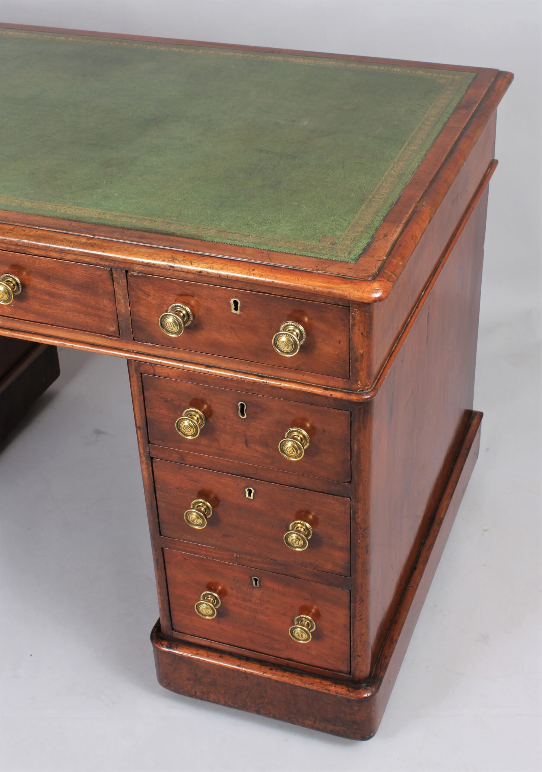 A mahogany three-part pedestal desk