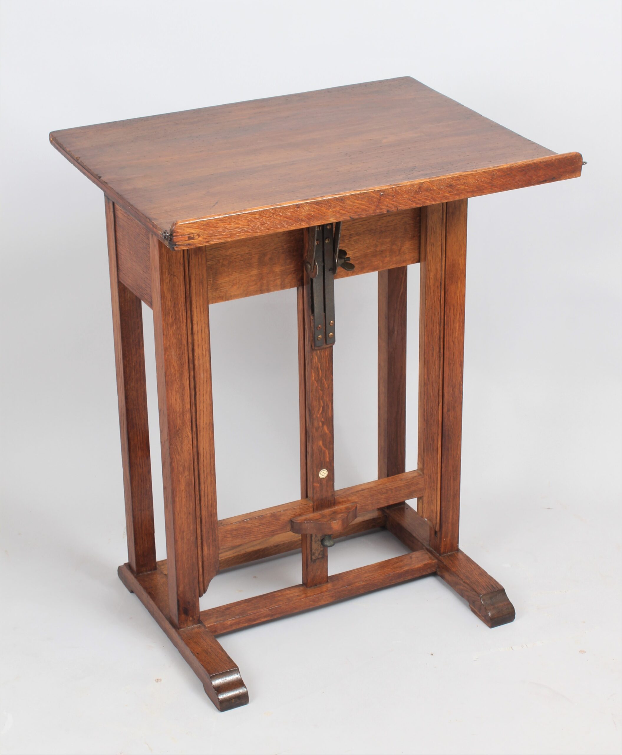A late 19th century English oak artist’s easel by C Roberson & Co
