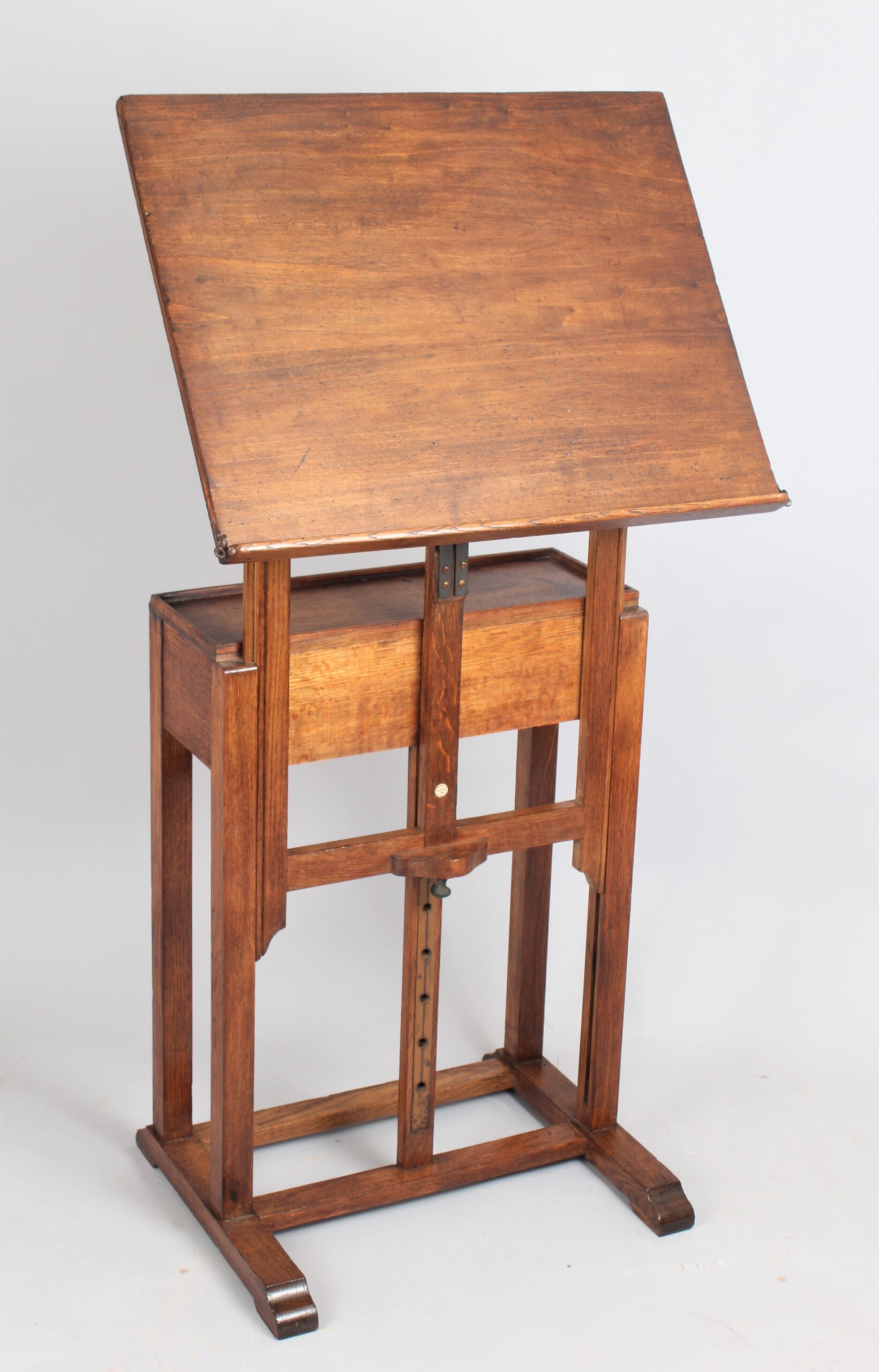 A late 19th century English oak artist’s easel by C Roberson & Co