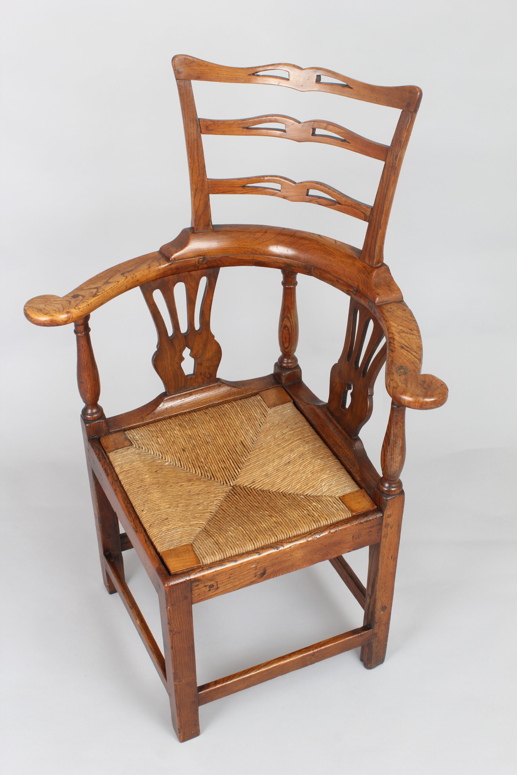 A George III period elm corner-chair