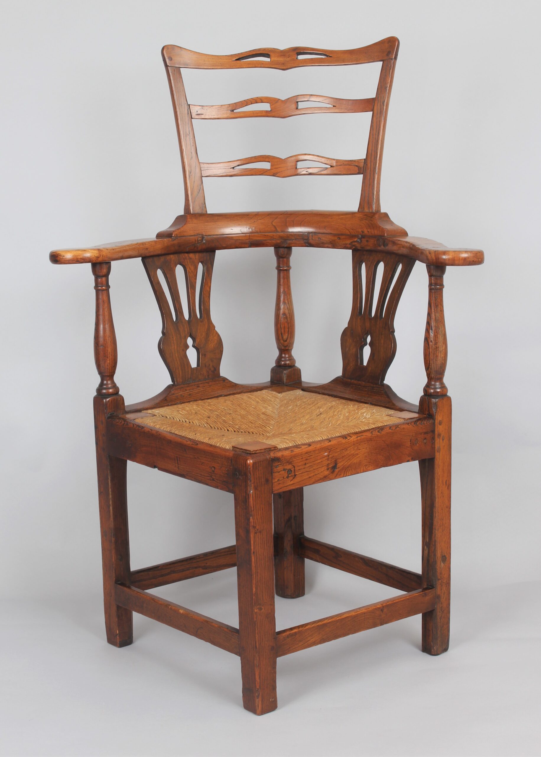 A George III period elm corner-chair