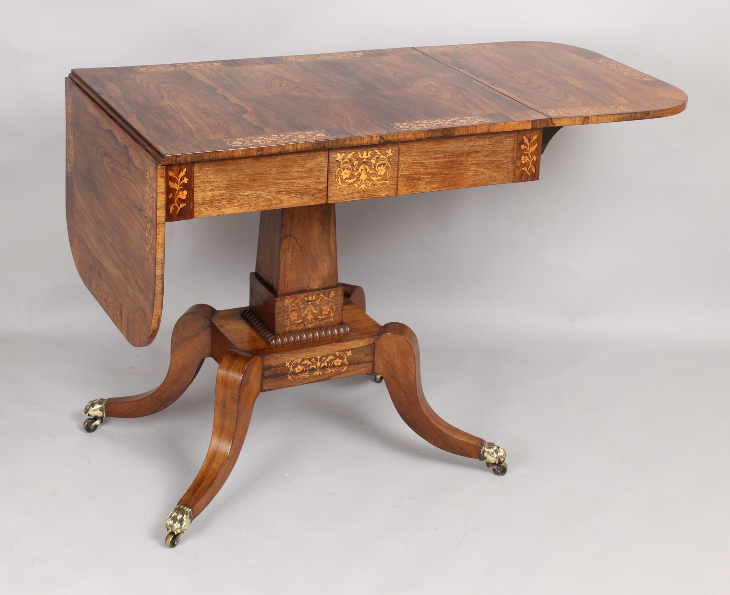 A fine Regency period sofa table of unusually small proportions