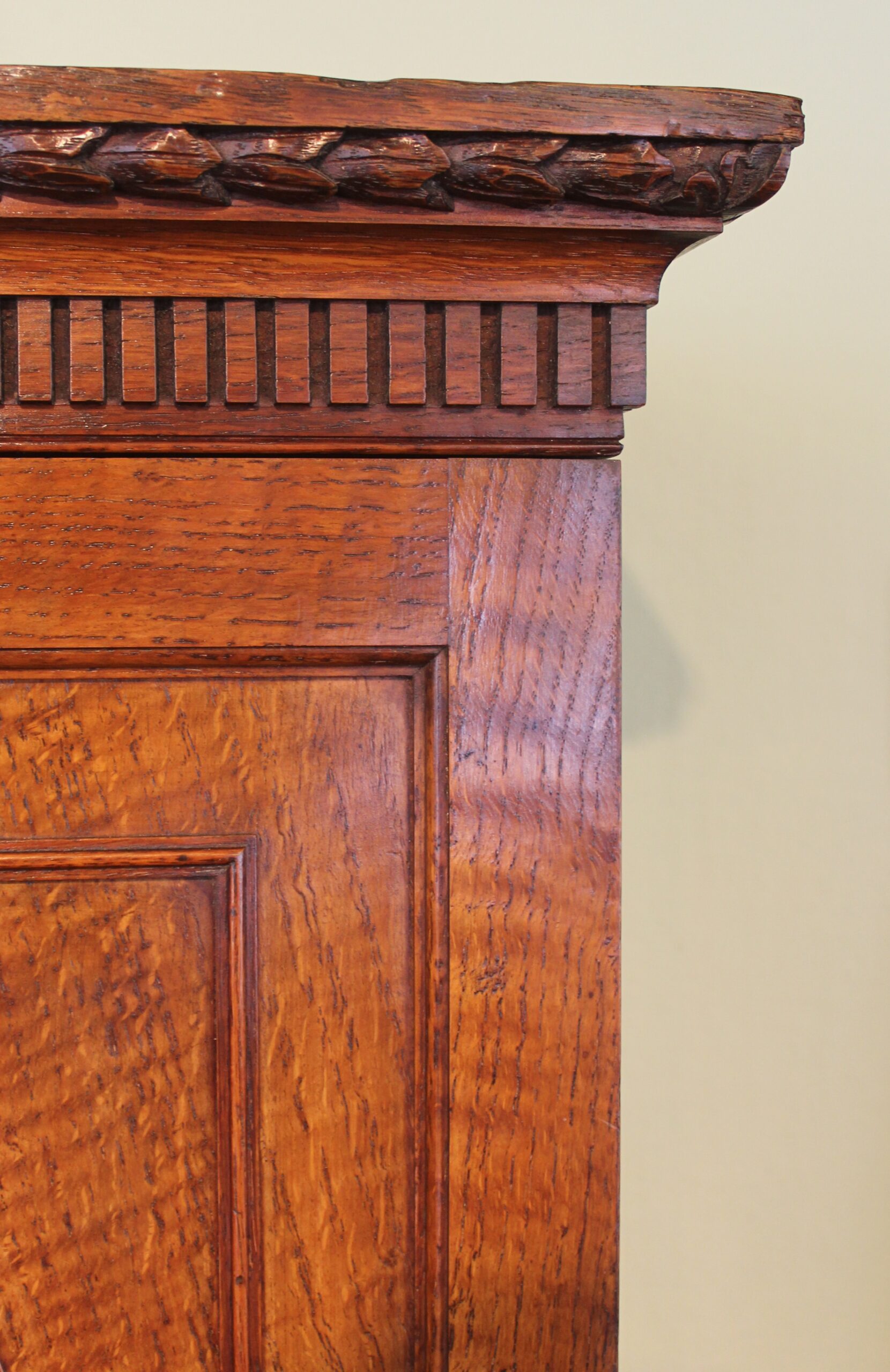 An Edwardian oak stationery cabinet