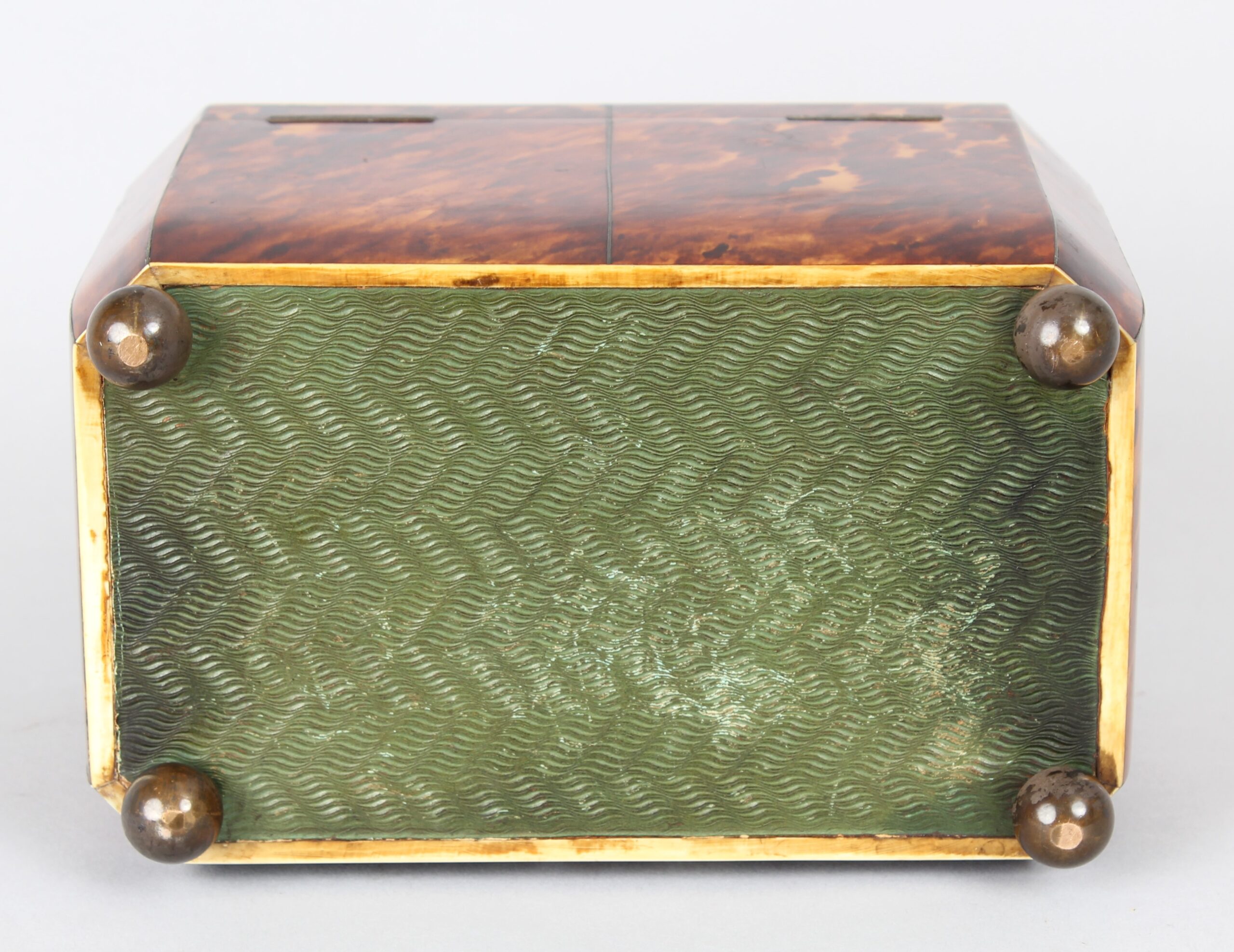 A fine WIV period casket shaped well figured tortoiseshell and engraved mother of pearl inlaid tea caddy