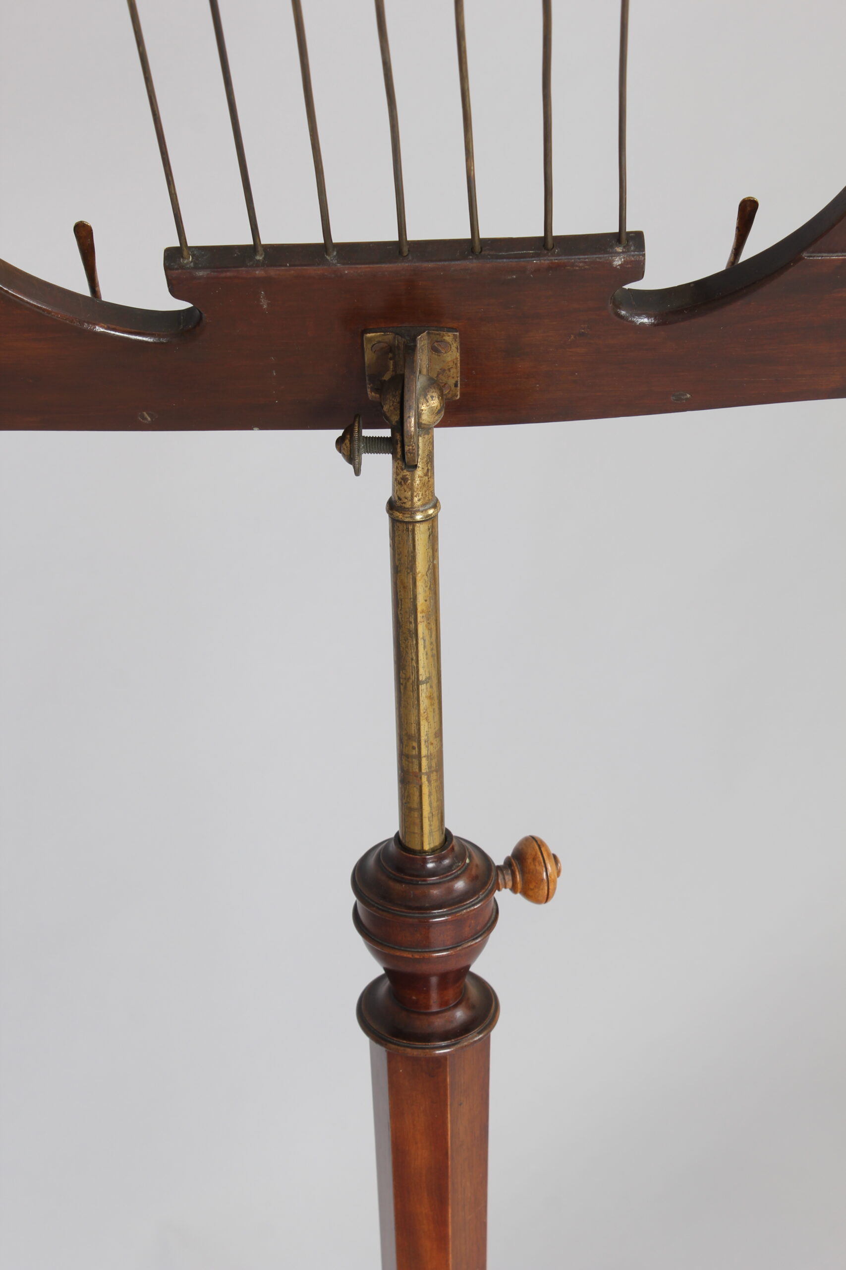 A late 19th century satinwood music-stand in the Sheraton style