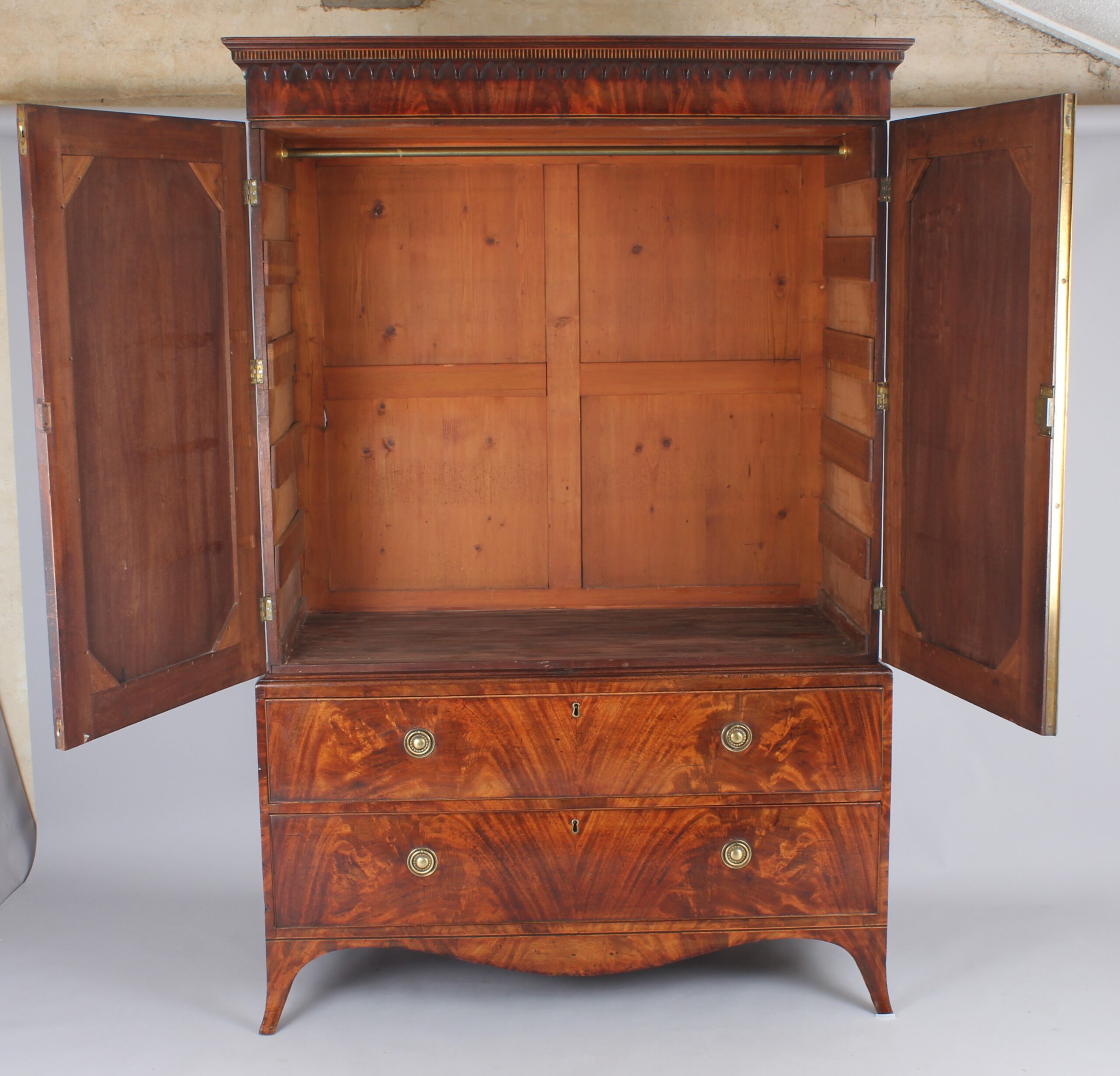 A fine and small George III mahogany linen press