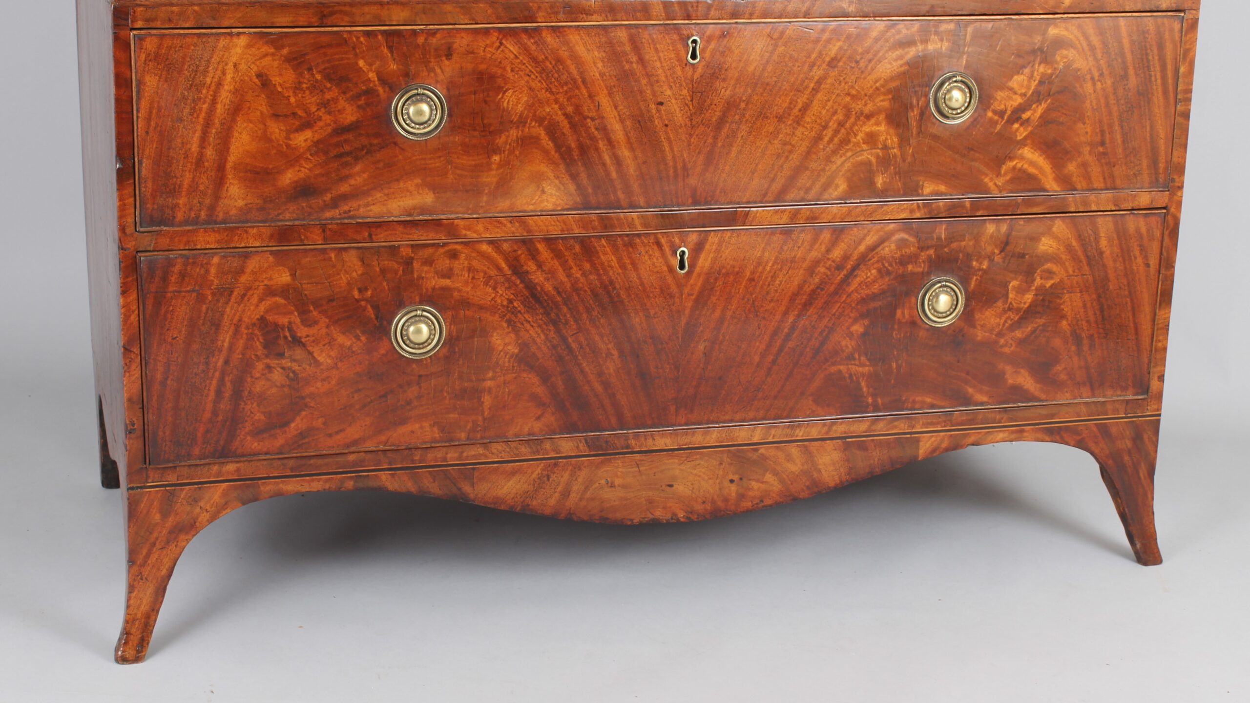 A fine and small George III mahogany linen press