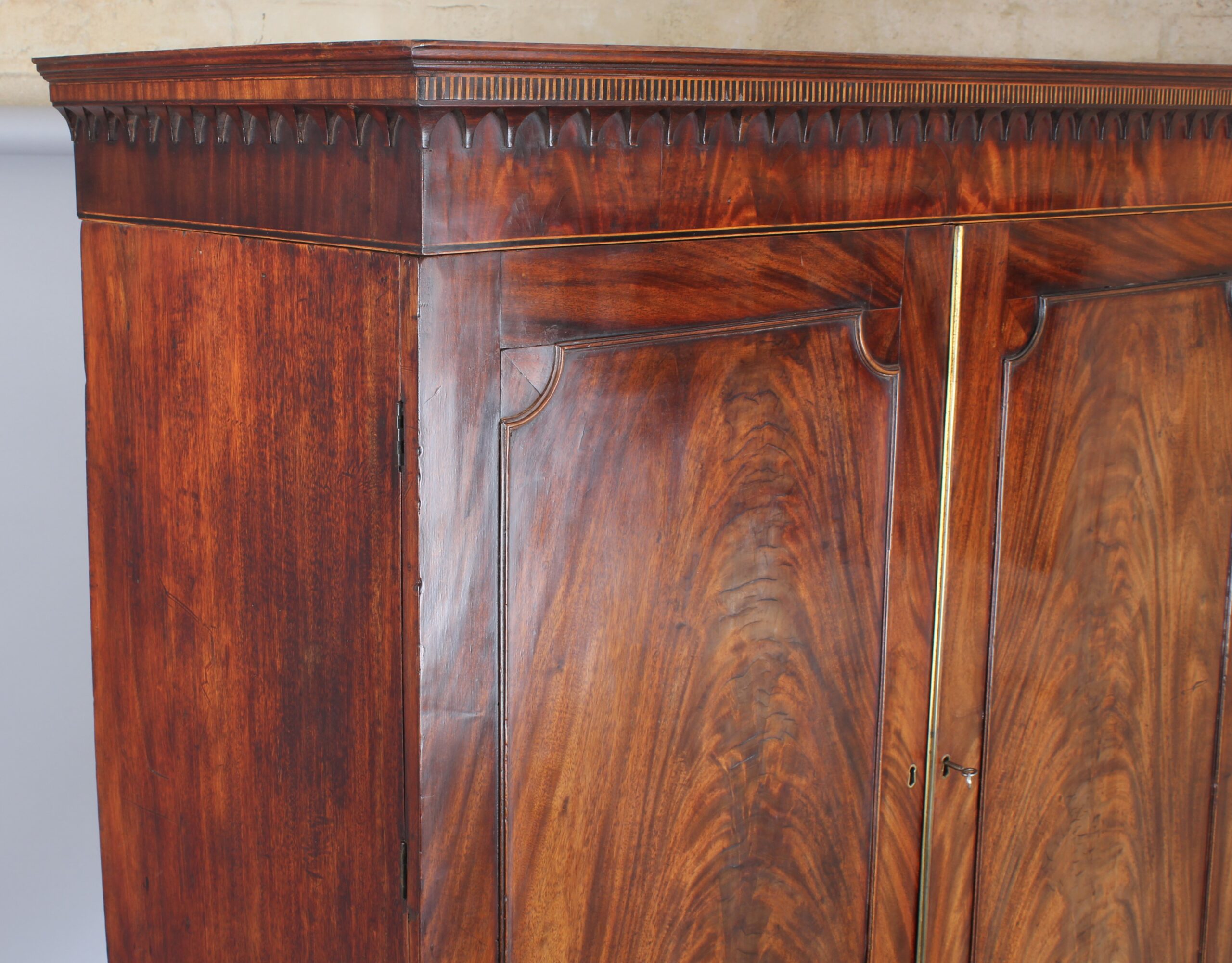 A fine and small George III mahogany linen press