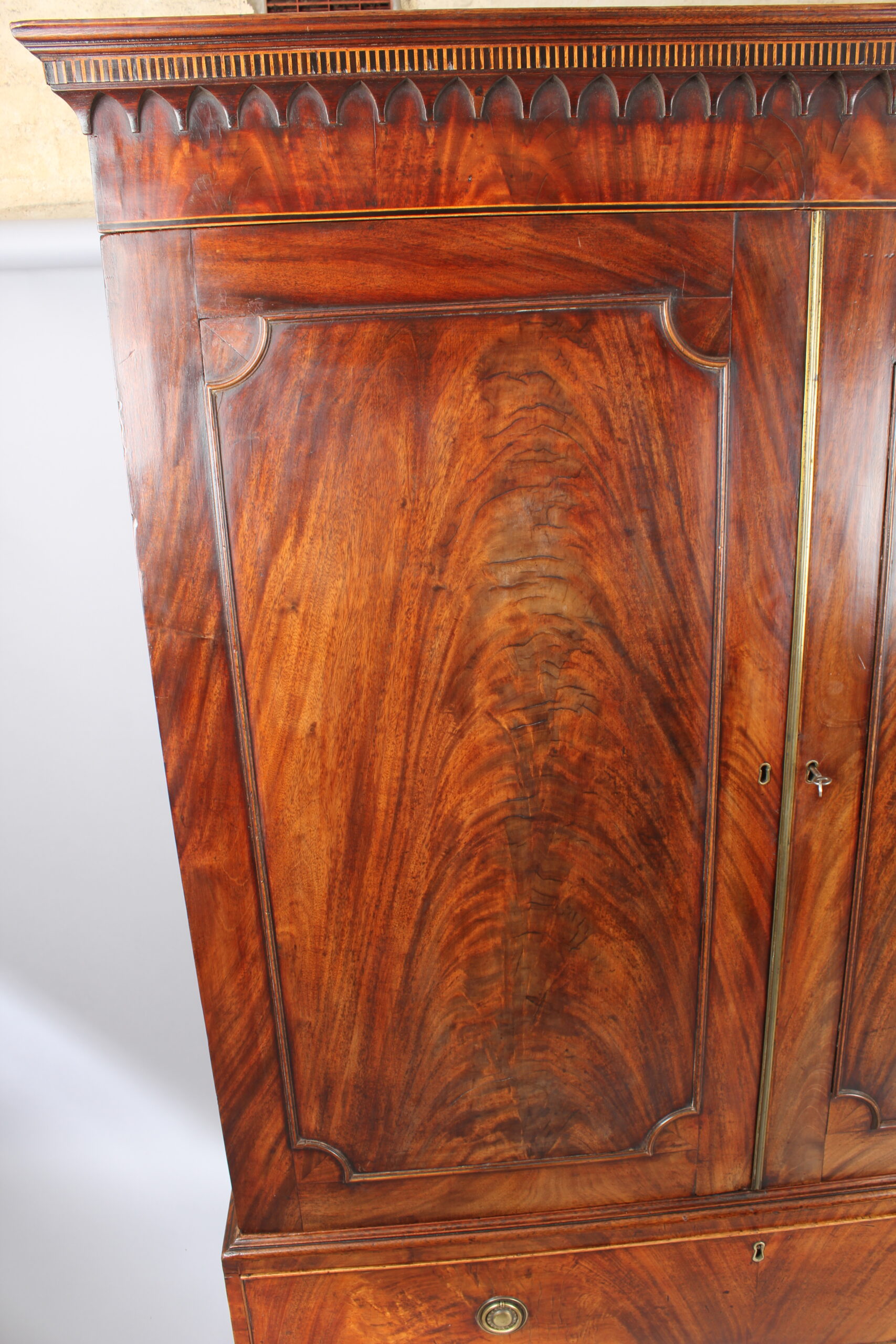A fine and small George III mahogany linen press