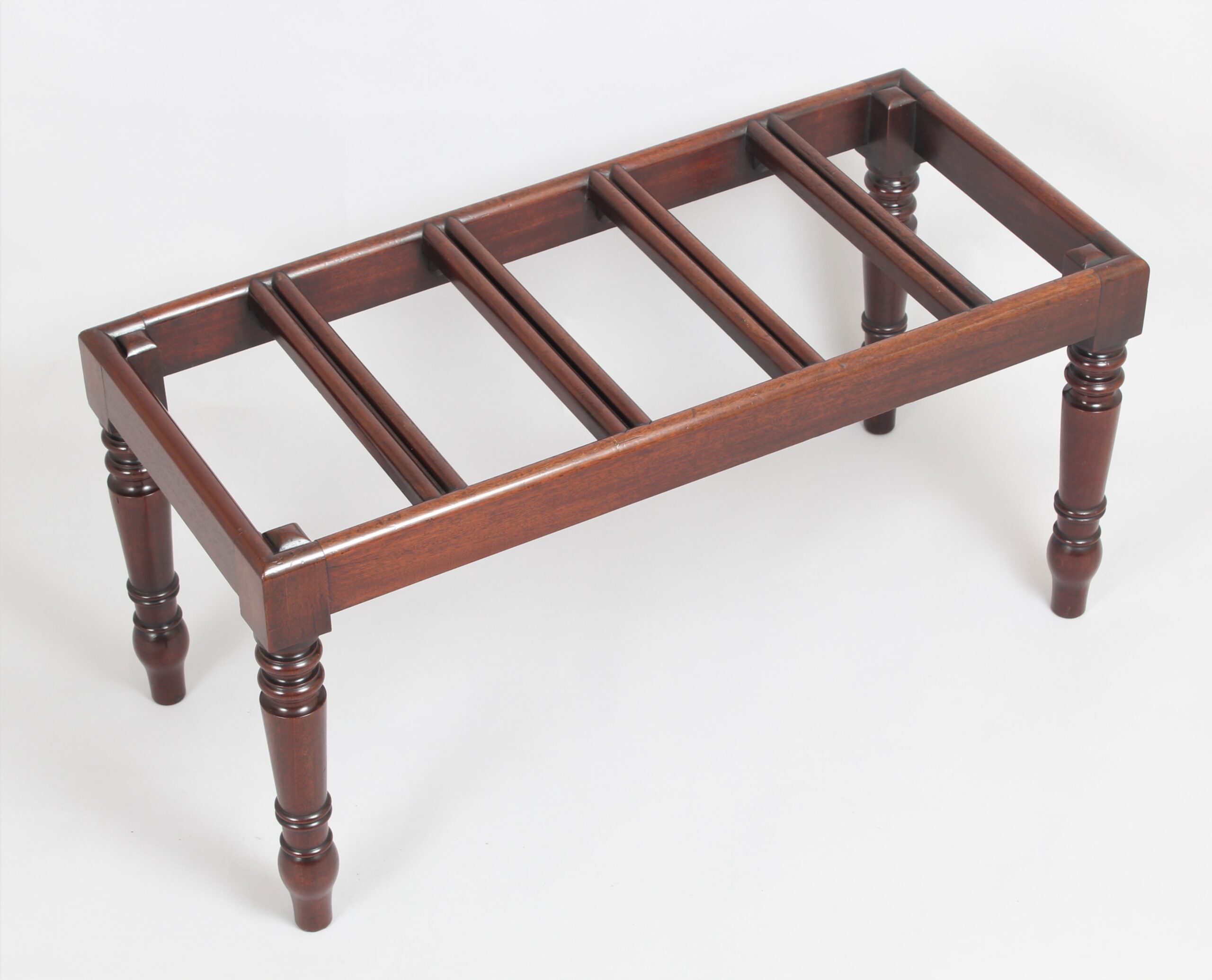 A very fine mahogany luggage stand