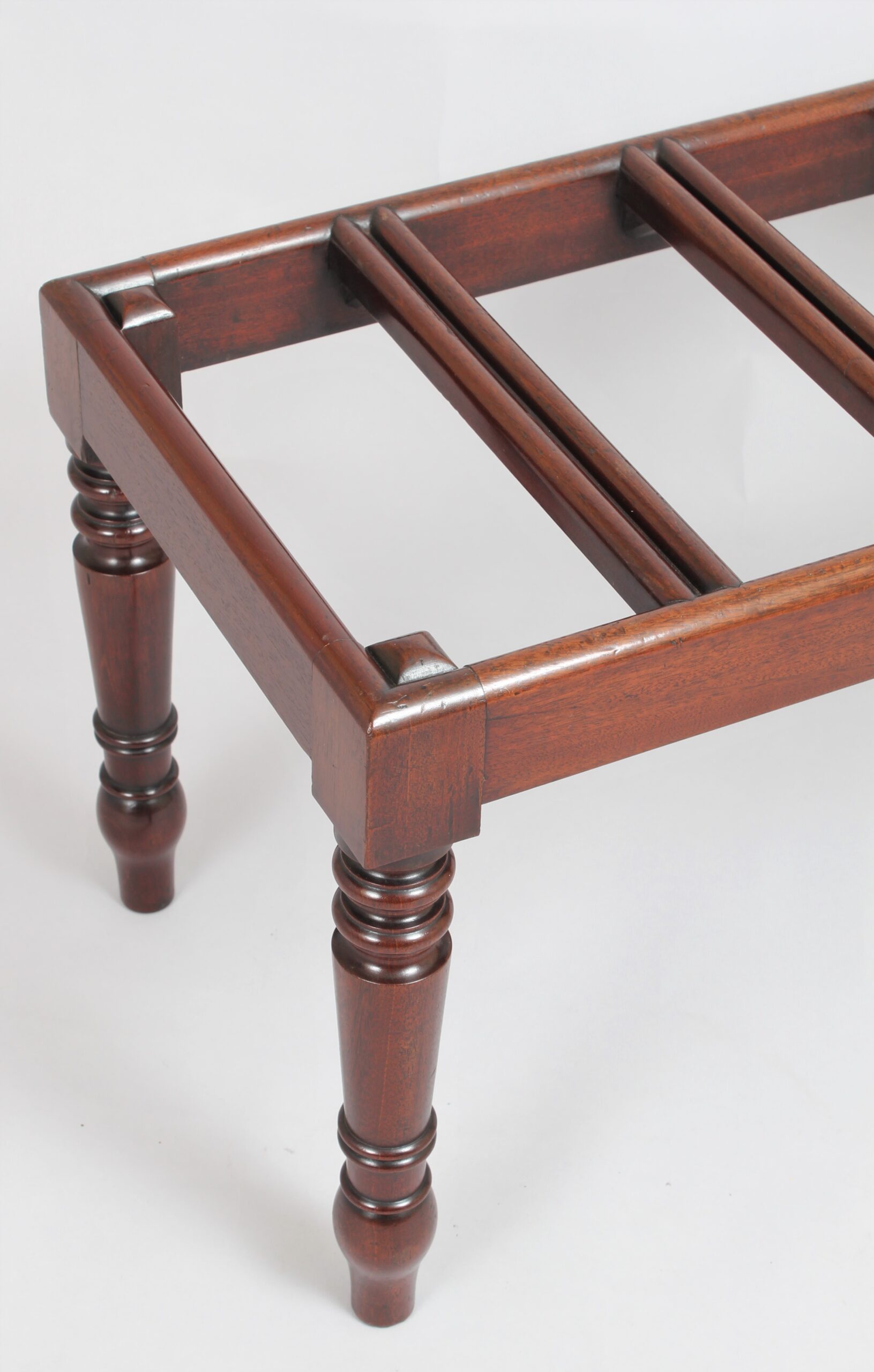 A very fine mahogany luggage stand
