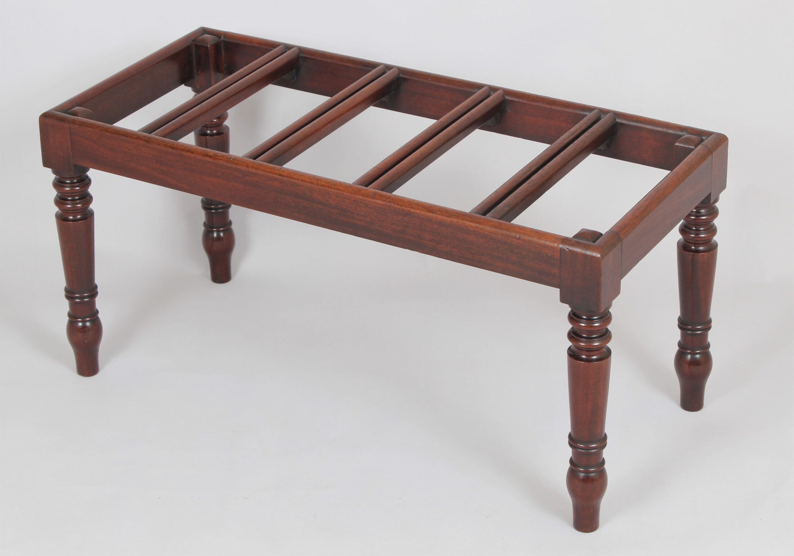 A very fine mahogany luggage stand