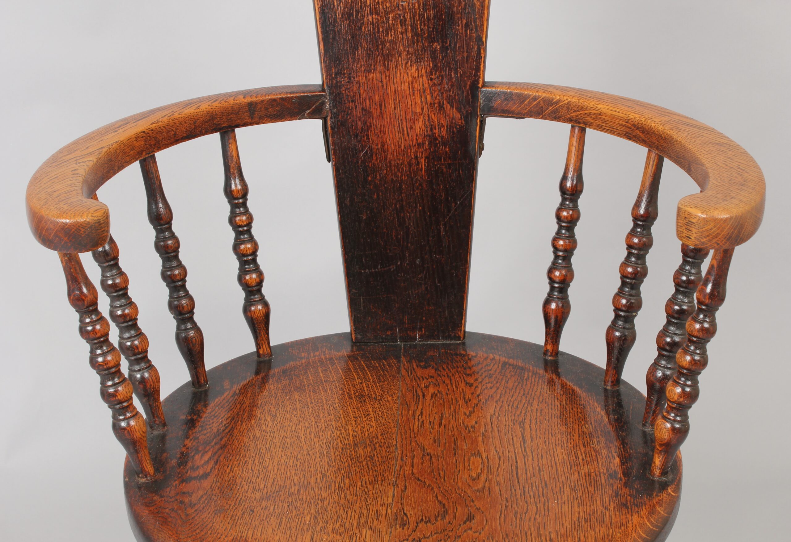 Early 20th century oak arm-chair of unusual form