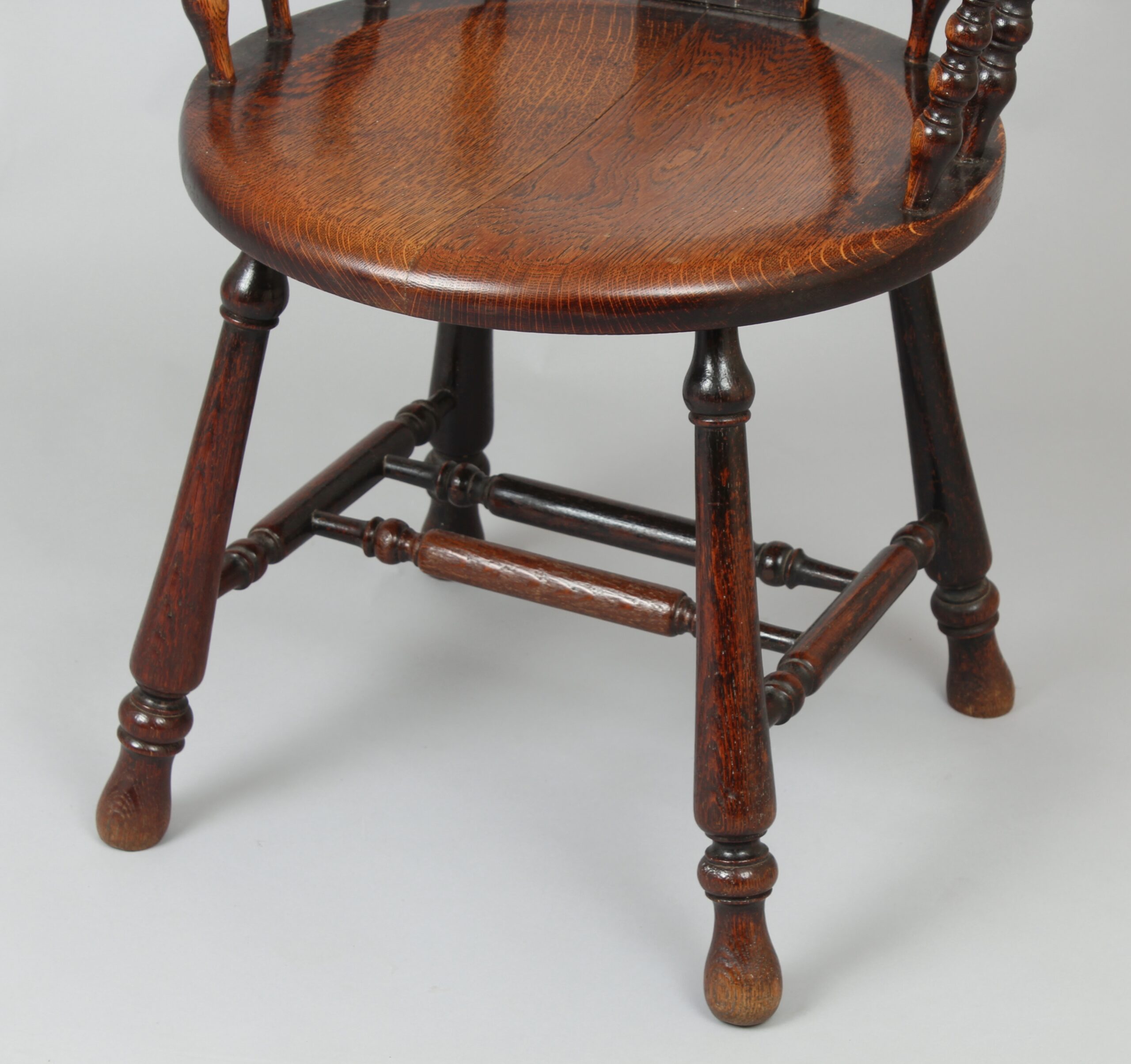 Early 20th century oak arm-chair of unusual form