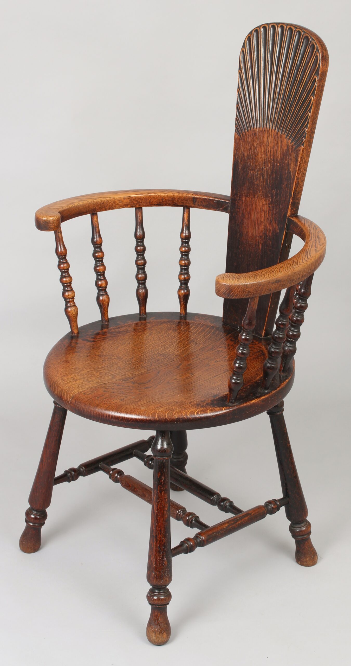 Early 20th century oak arm-chair of unusual form