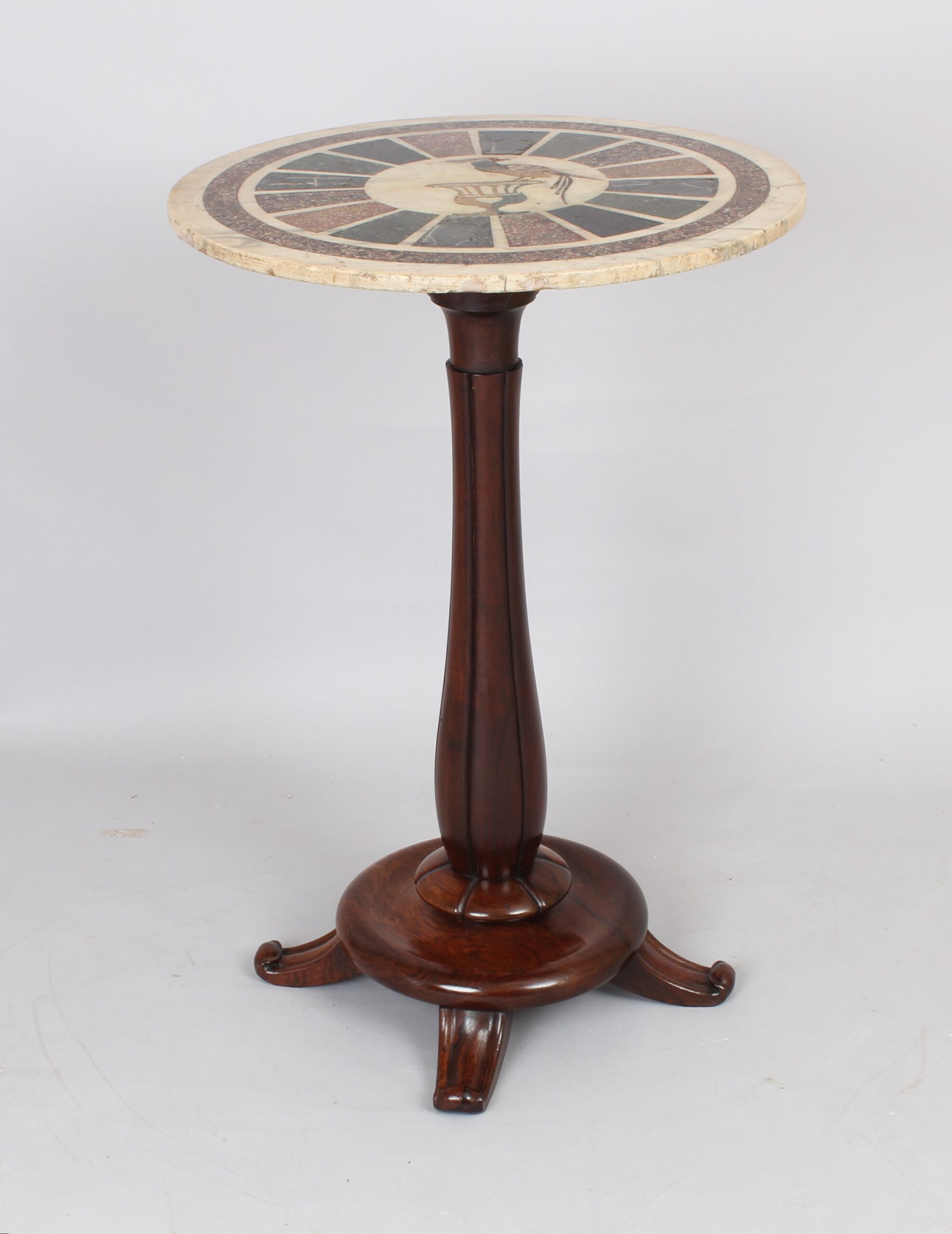 An early 19th century marble-topped pedestal table